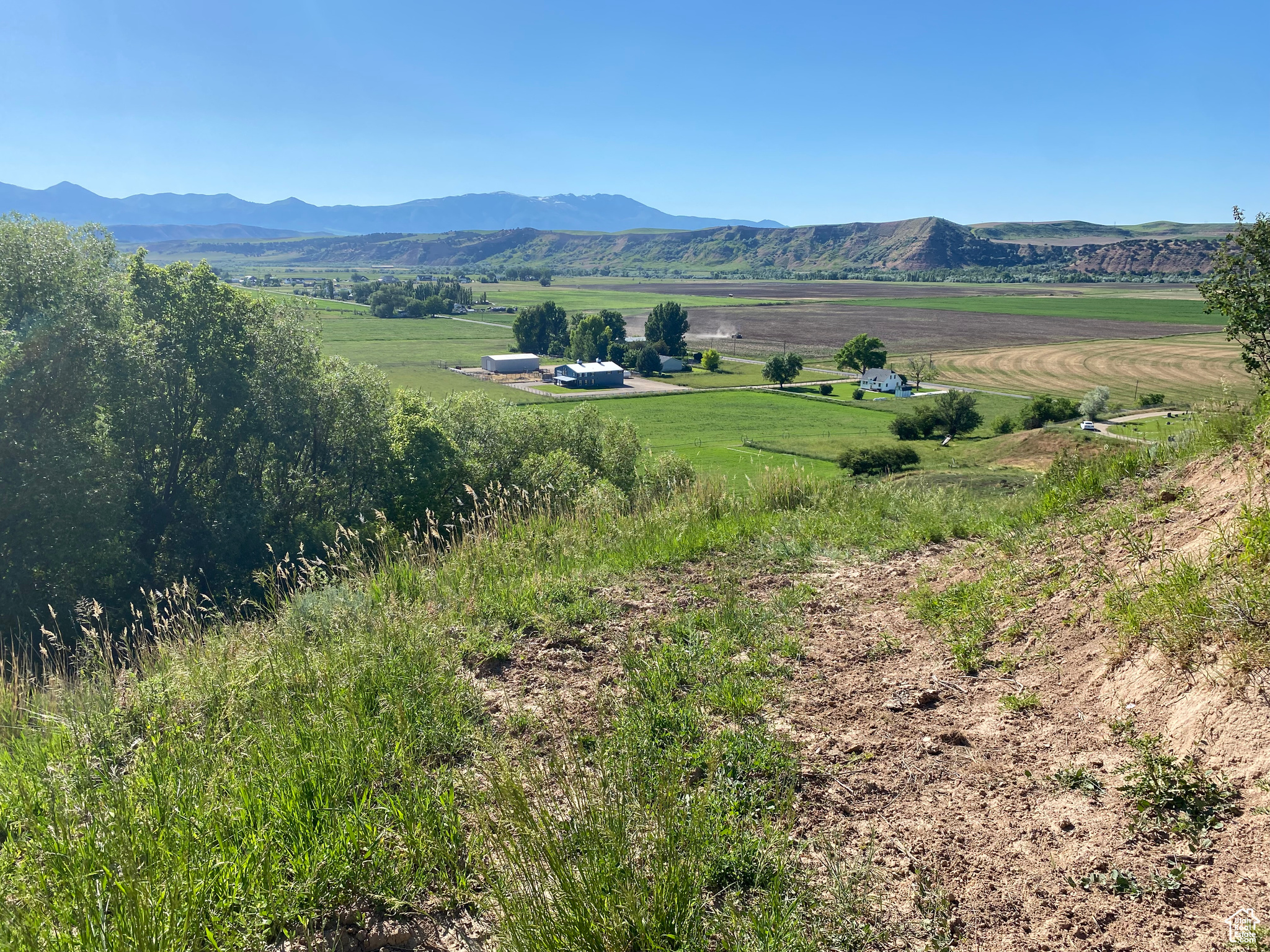 Property view of mountains with a rural view