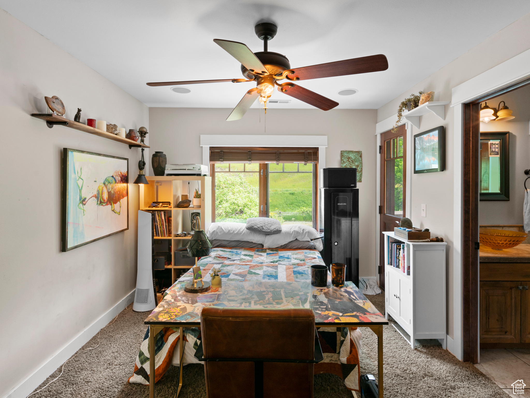 Bedroom featuring ceiling fan and great views