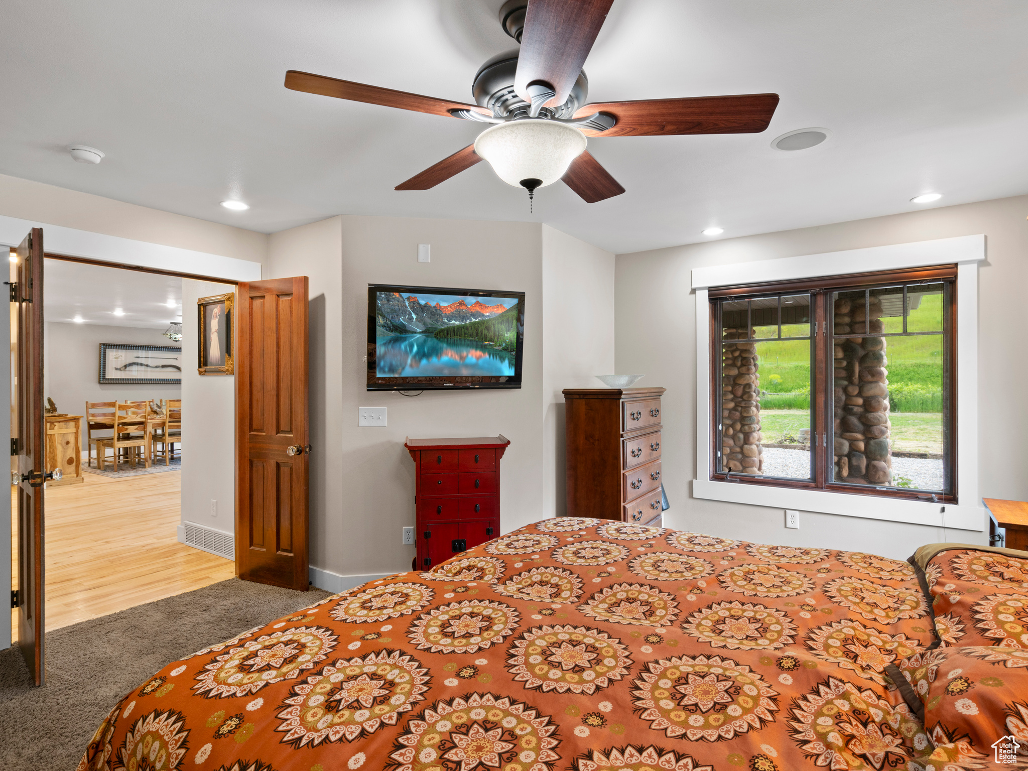 Master bedroom with ceiling fan, french doors, and great views