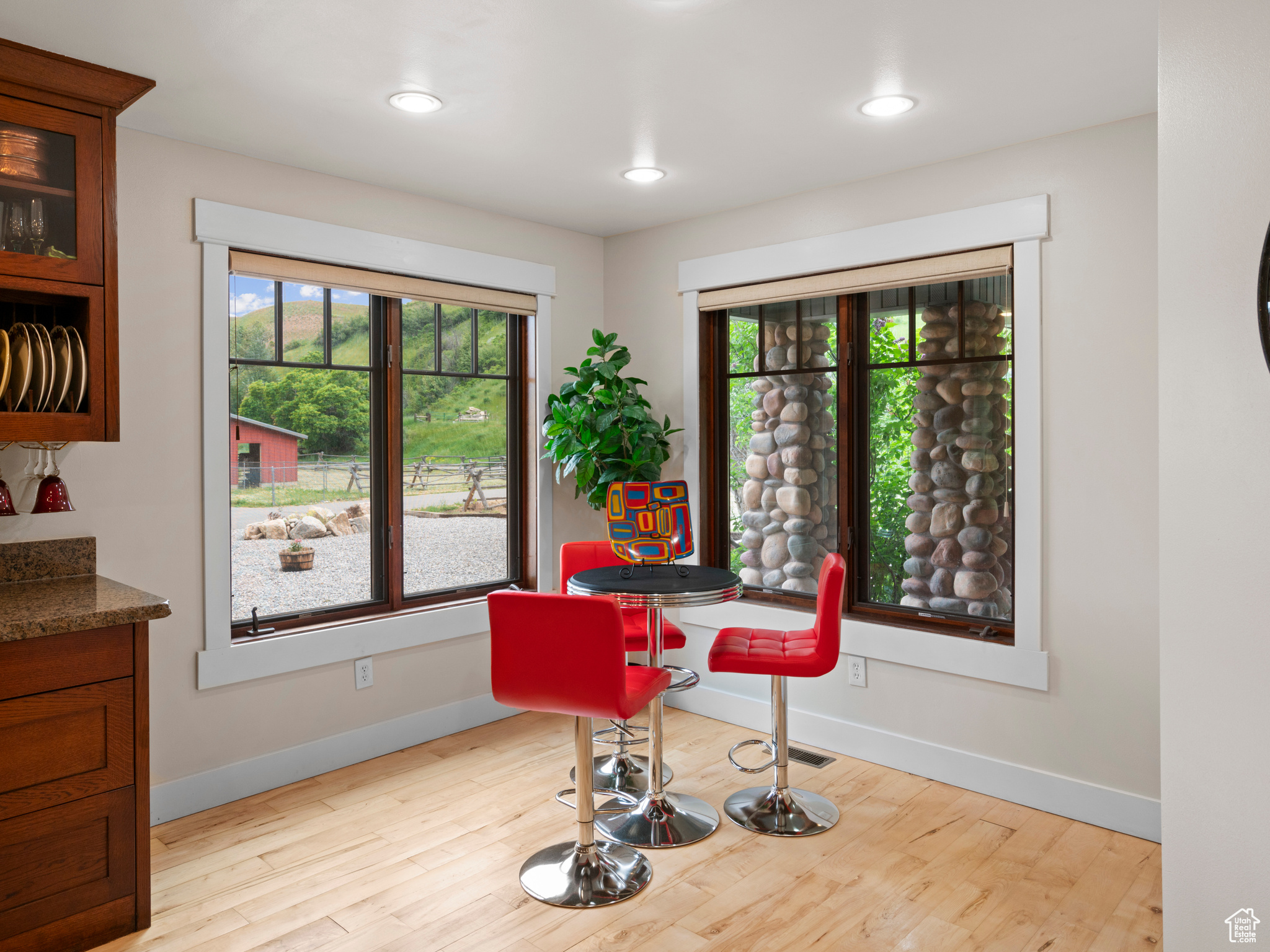 Breakfast nook with views and hardwood flooring