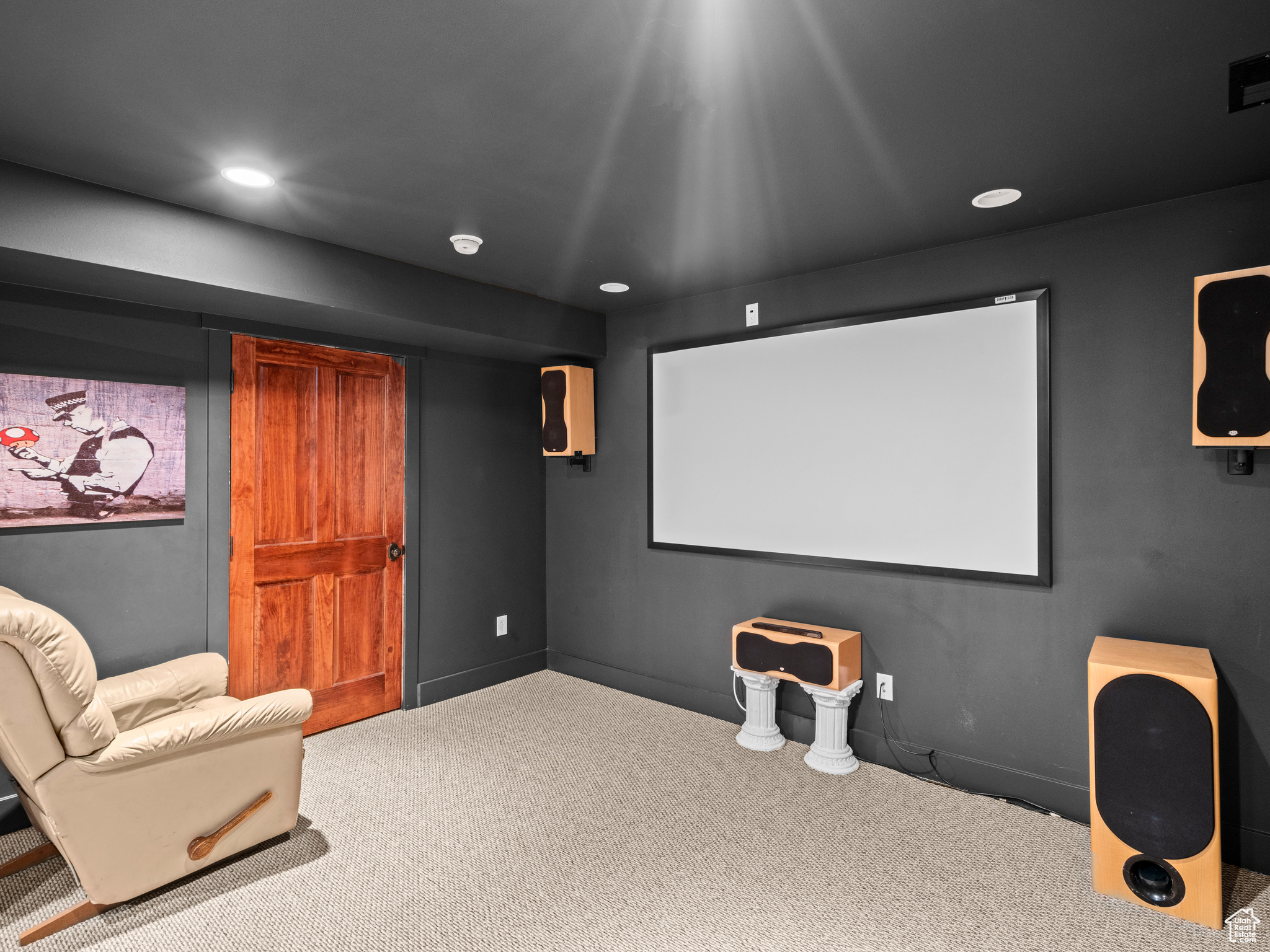 Home theater room featuring carpet floors