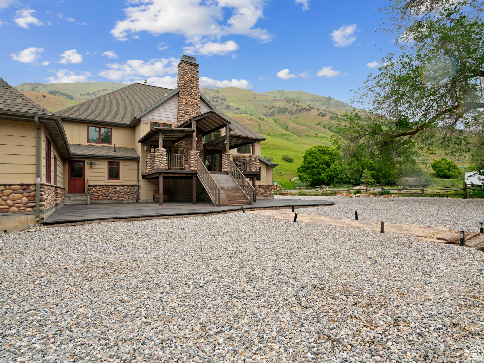 View of front of property featuring a deck with mountain view