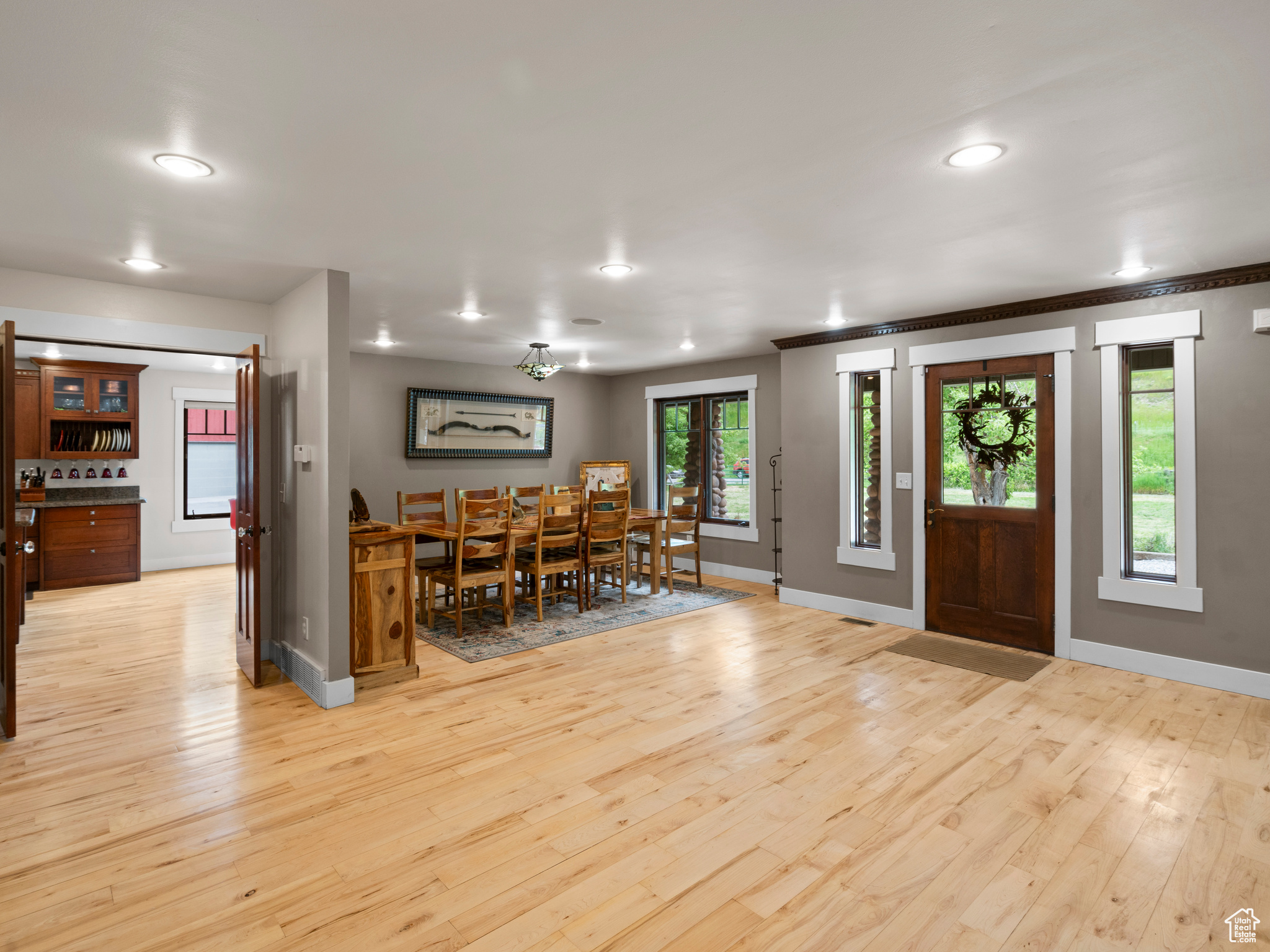 Entryway featuring a wealth of natural light and hardwood flooring