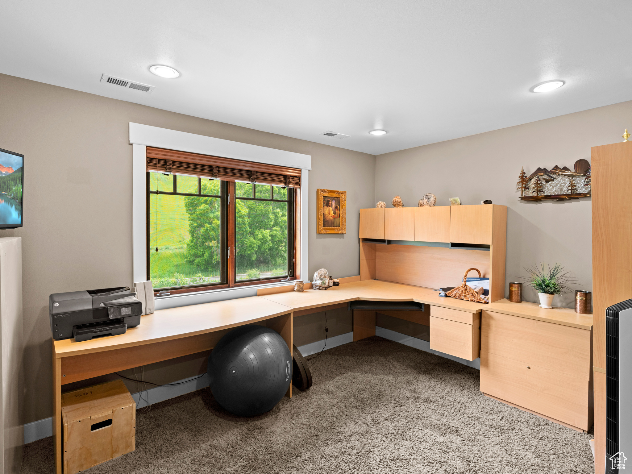 Carpeted office with built in desk