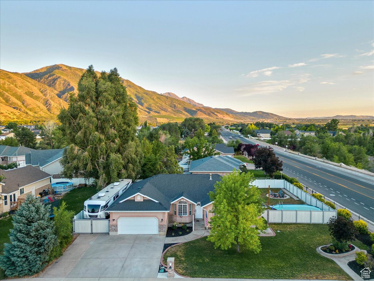 Aerial view at dusk featuring a mountain view