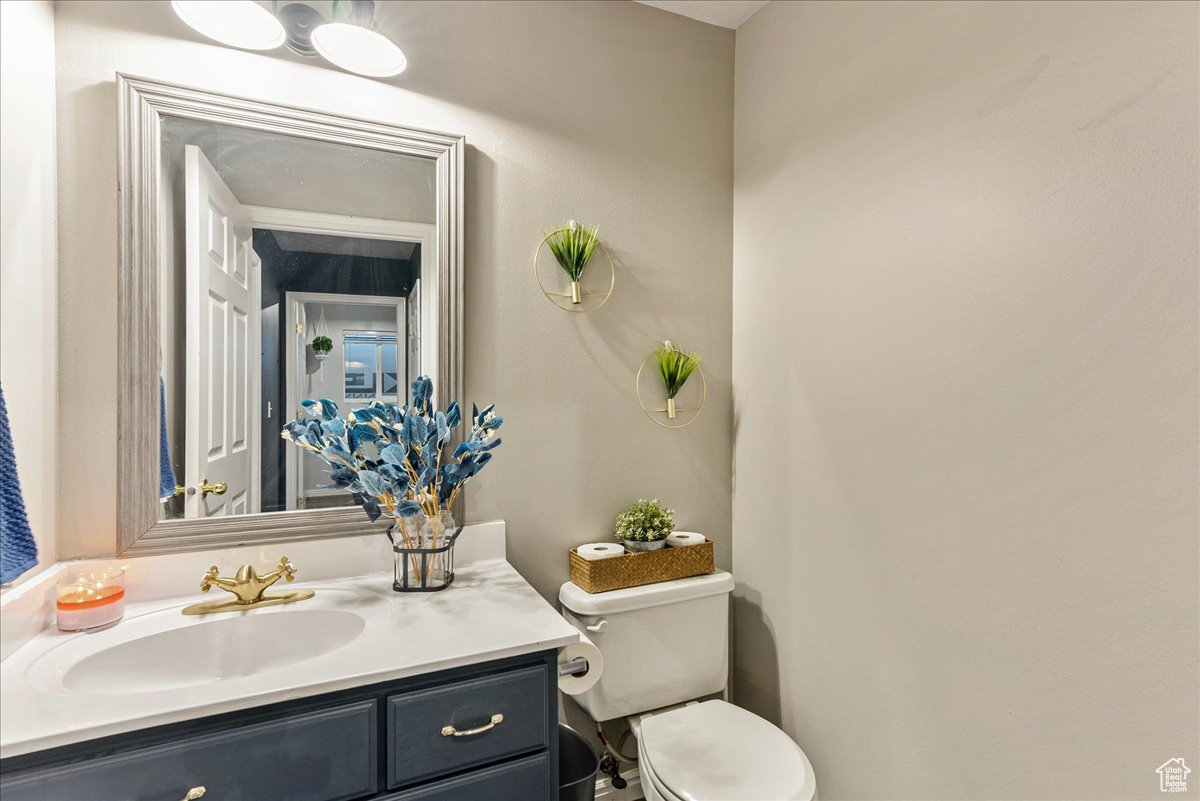 Bathroom featuring oversized vanity and toilet