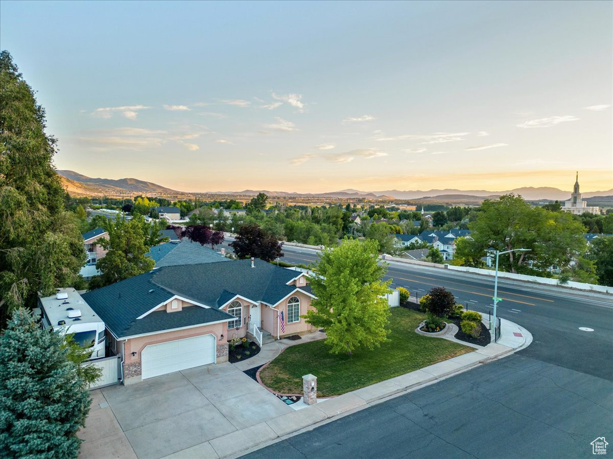 Aerial view at dusk featuring a mountain view