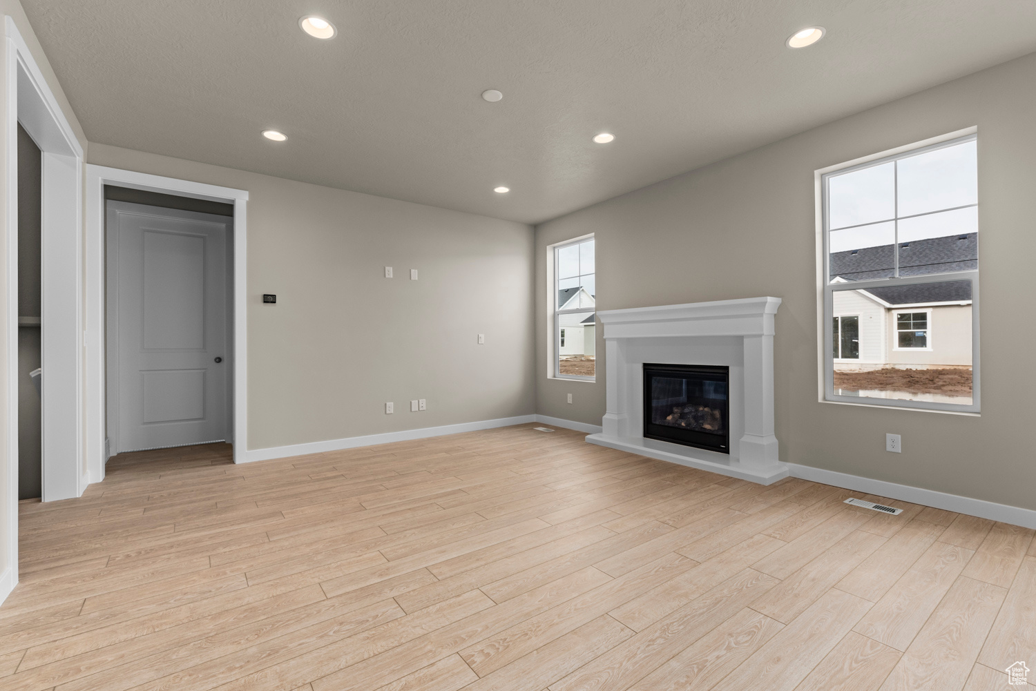 Unfurnished living room featuring light hardwood / wood-style flooring