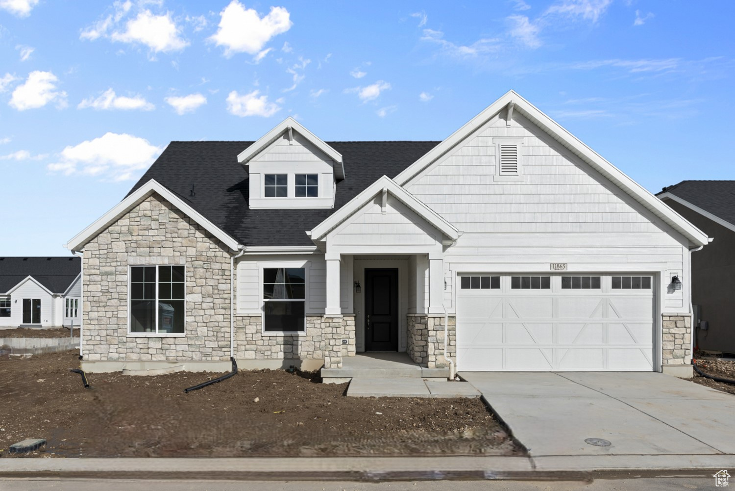 View of front of house with a garage