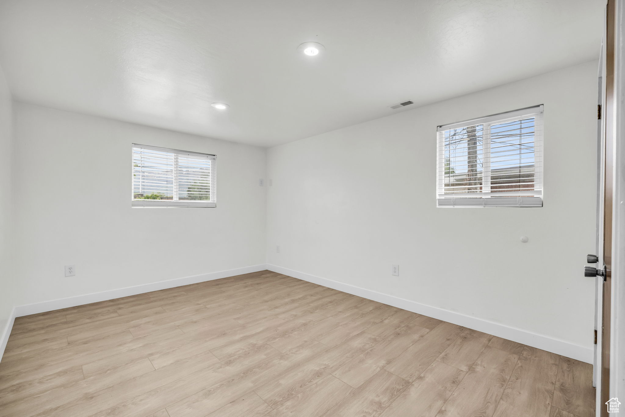 Empty room featuring light hardwood / wood-style flooring