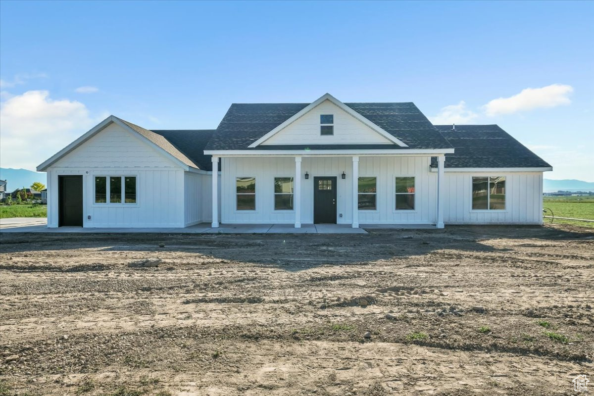 Modern inspired farmhouse with a patio area