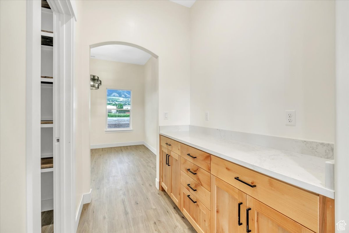 Corridor featuring light hardwood / wood-style floors