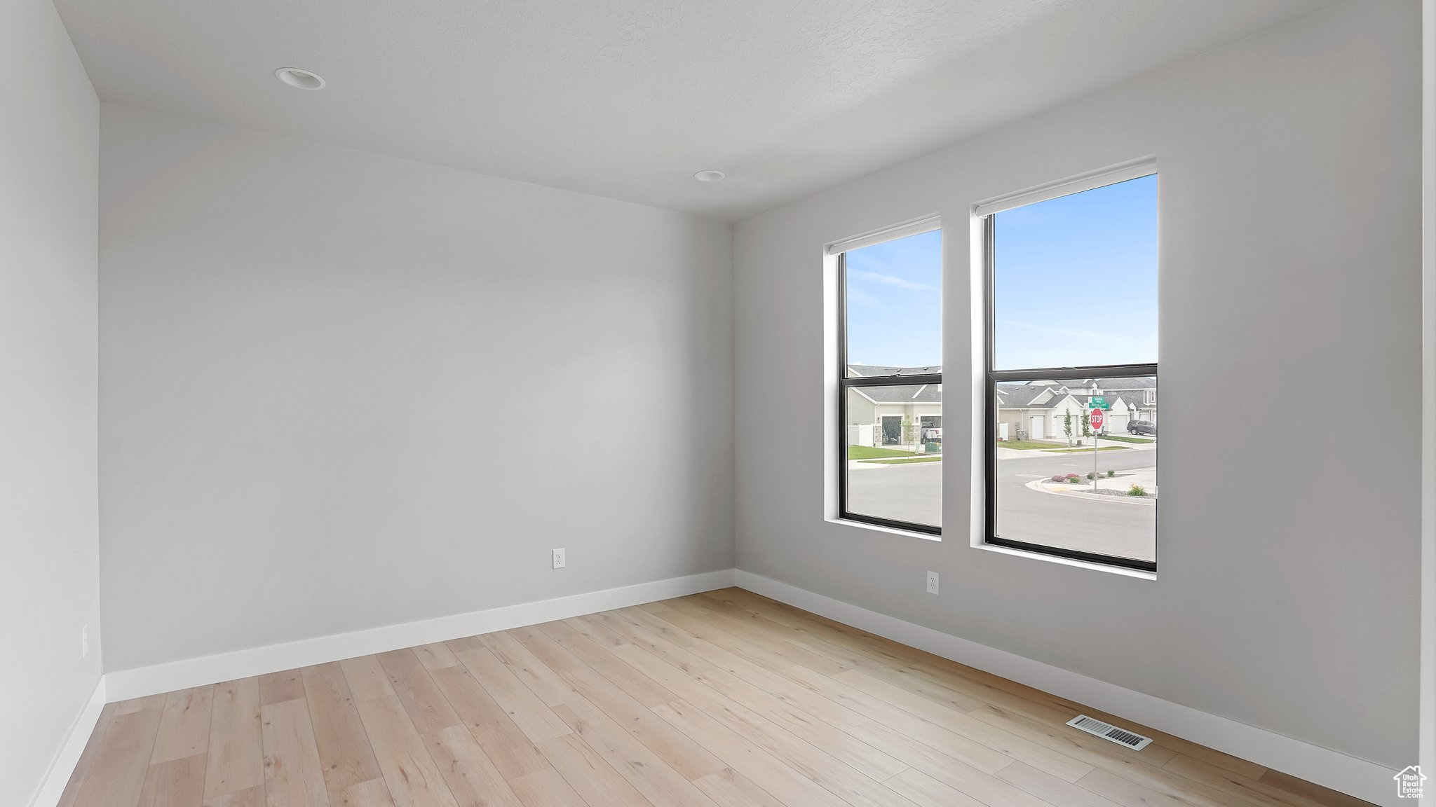 Unfurnished room with light hardwood / wood-style flooring