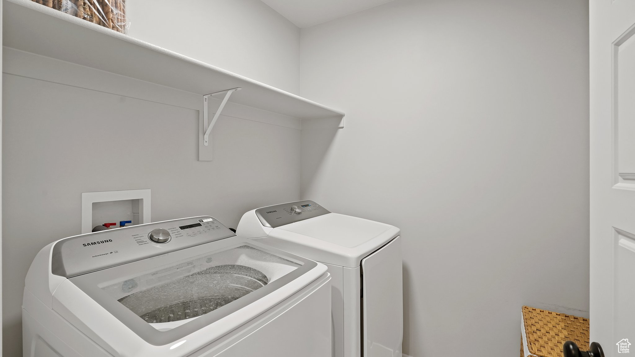 Washroom featuring separate washer and dryer and washer hookup