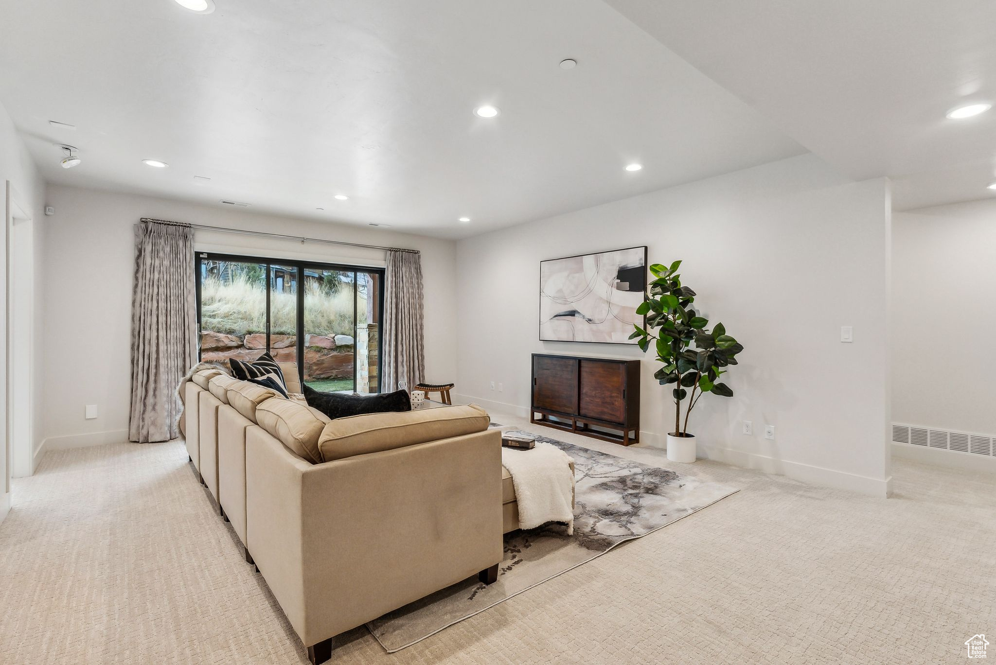Living room with light colored carpet