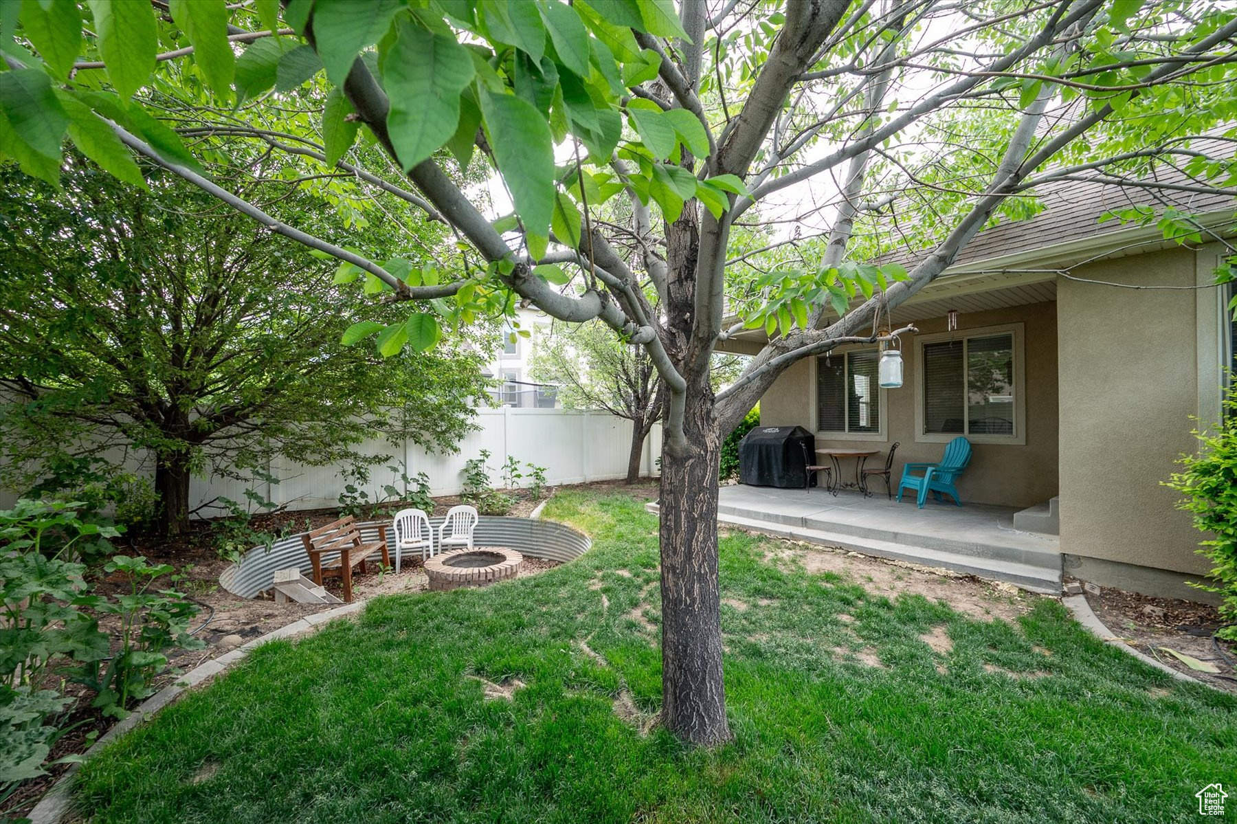 View of yard featuring a patio and an outdoor fire pit