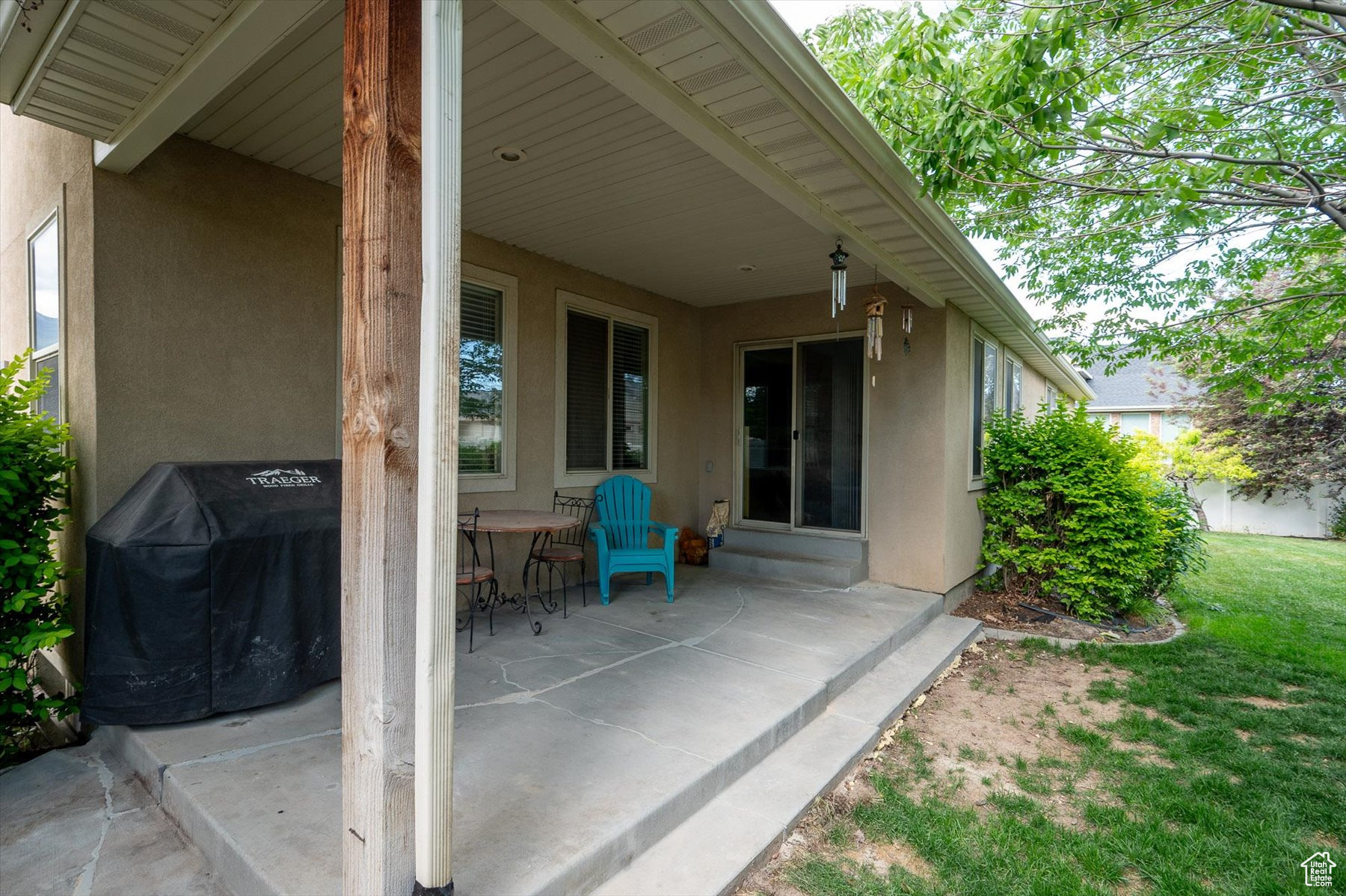 View of patio featuring a grill