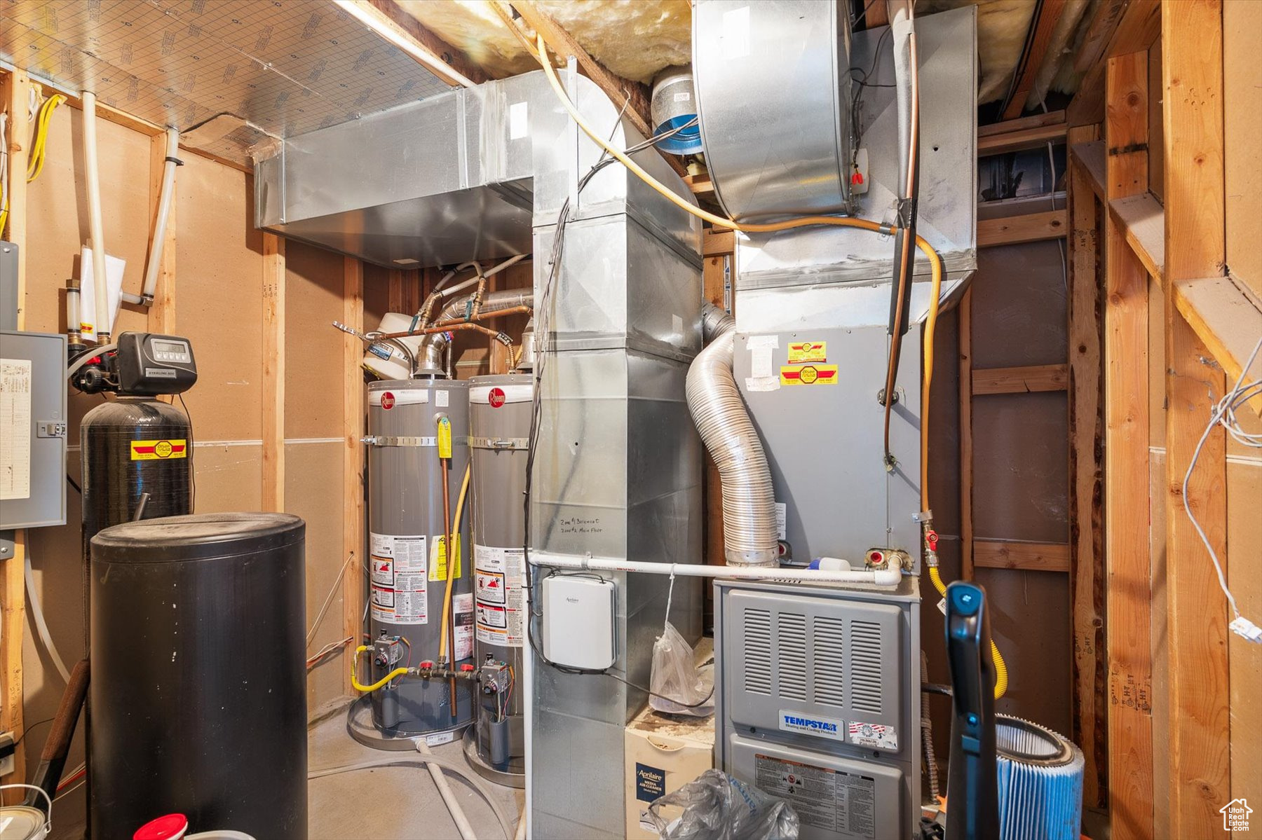 Utility room featuring strapped dual water heaters Water softner, Furnace/AC with electric aircleaner to keep the dusting to minimum