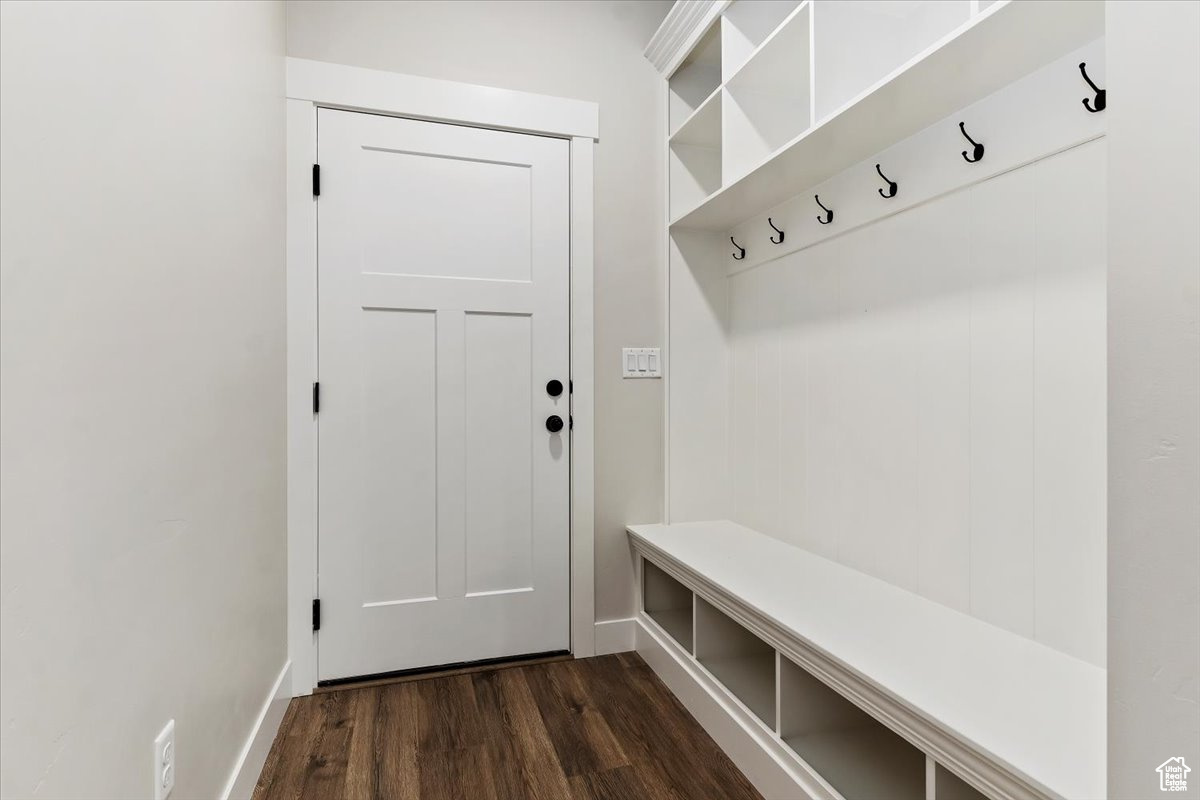 Mudroom with dark hardwood / wood-style flooring