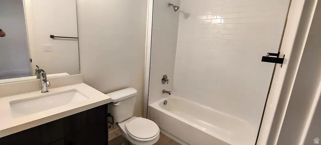 Full bathroom featuring shower / tub combination, toilet, and vanity