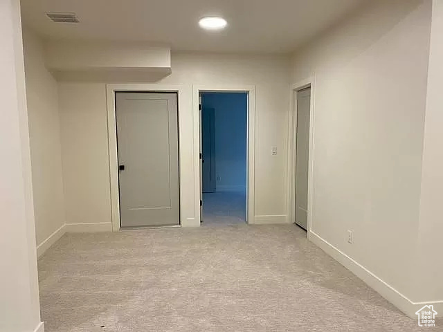 Unfurnished room featuring carpet floors