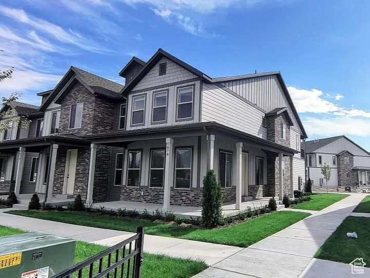 View of property exterior with a yard