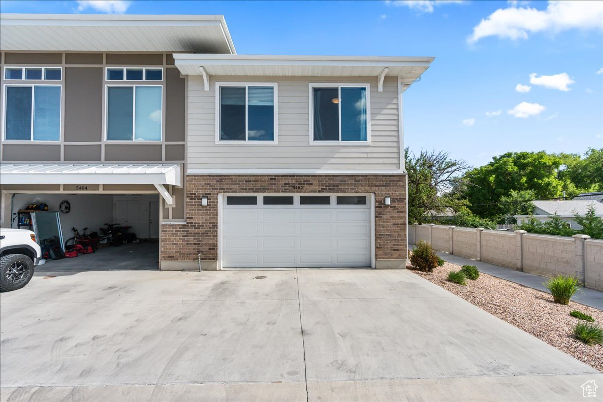 View of front of home featuring a garage