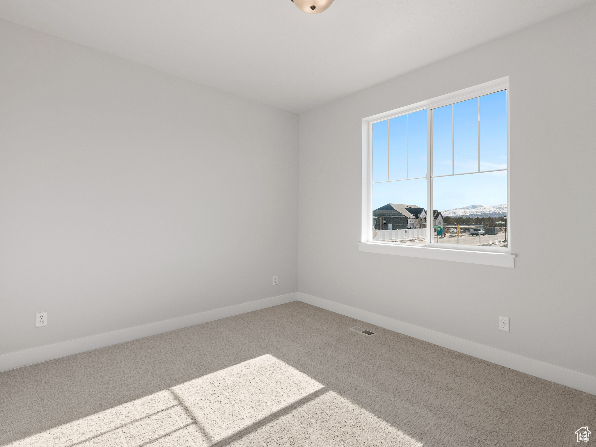 View of carpeted spare room. This is a picture of Helena model home. Not the interior of actual home.