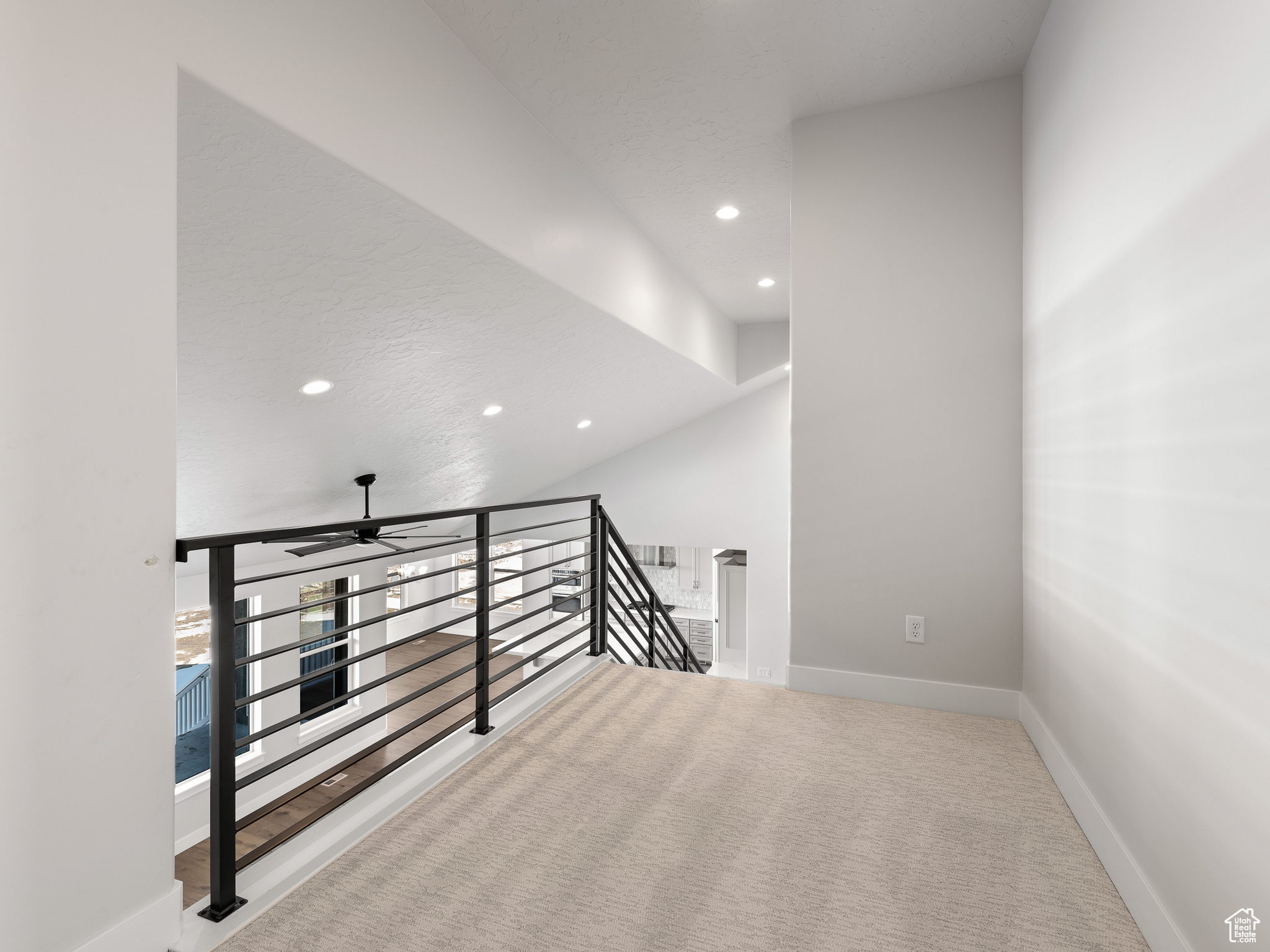 Stairs featuring carpet and ceiling fan. This is a picture of Helena model home. Not the interior of actual home.