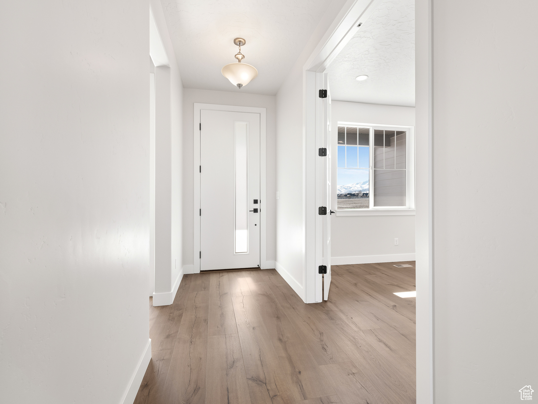 Foyer entrance with hardwood / wood-style flooringThis is a picture of Helena model home. Not the interior of actual home.