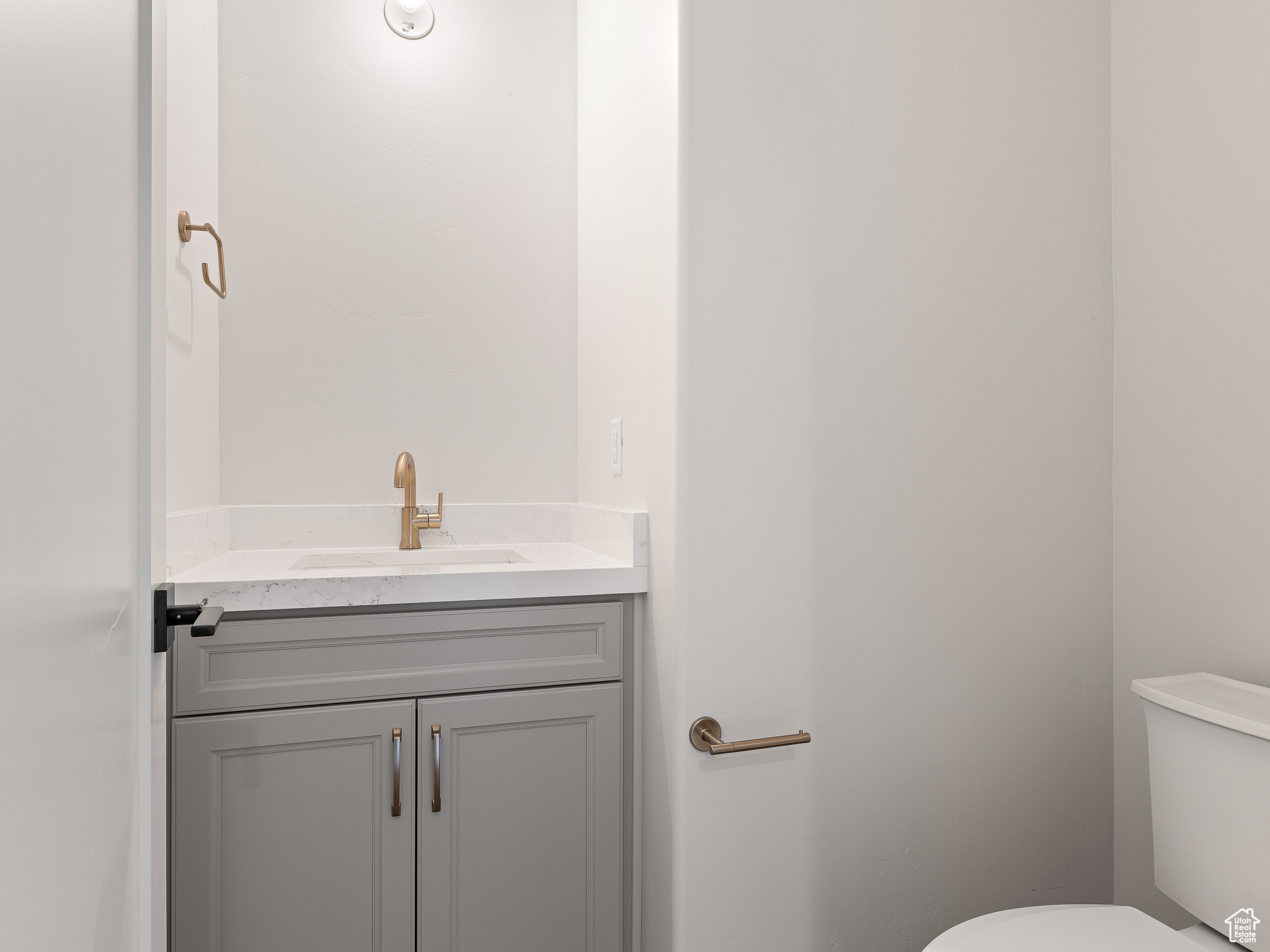 Bathroom featuring vanity and toilet. This is a picture of Helena model home. Not the interior of actual home.