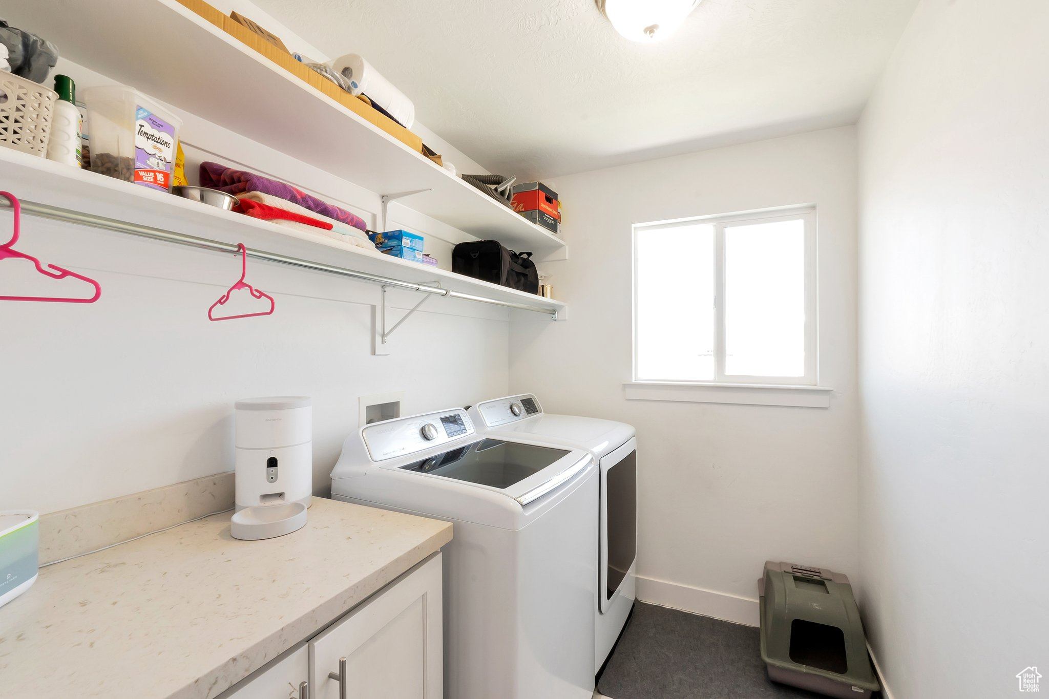 Laundry area with washer hookup and washing machine and clothes dryer