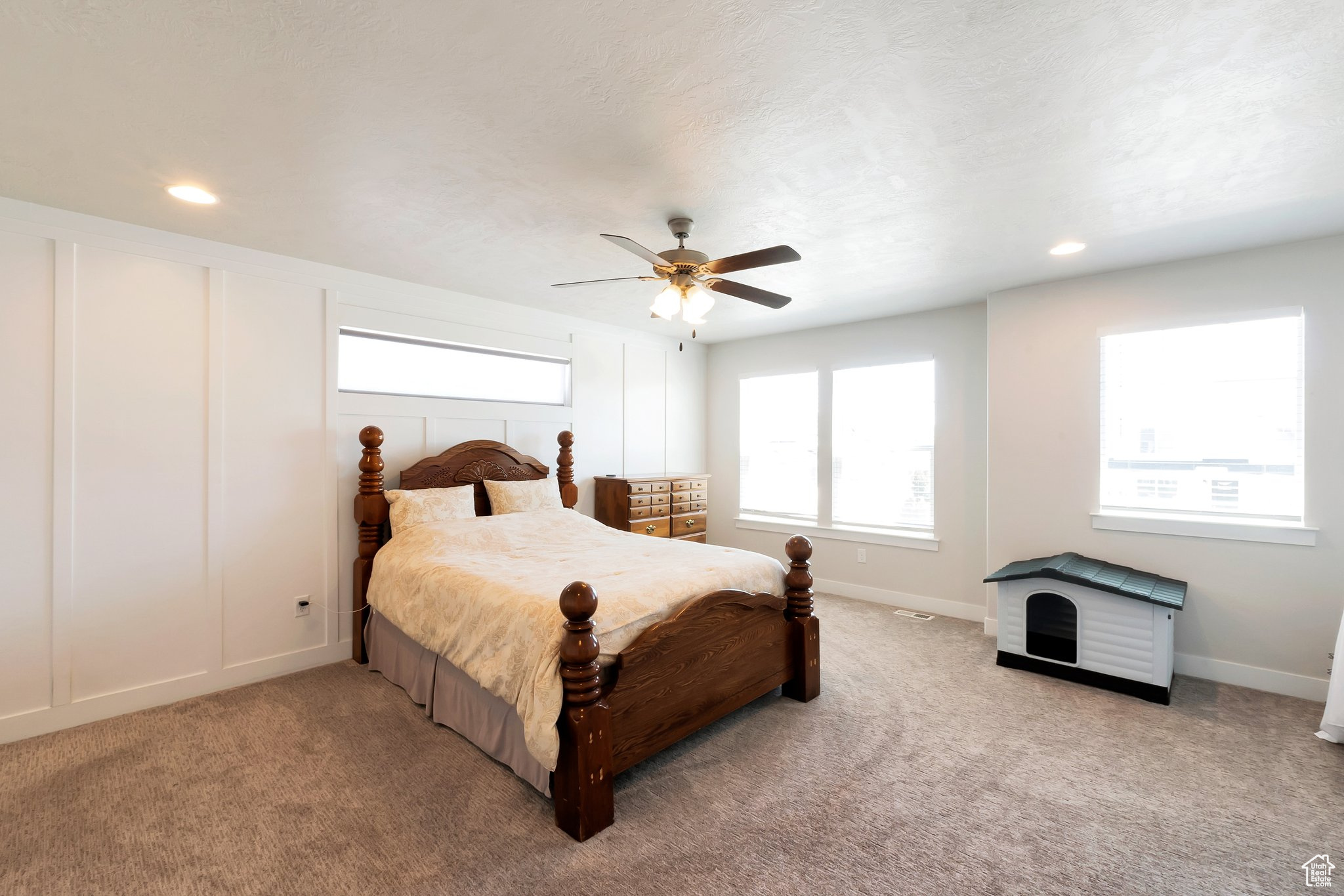 Bedroom featuring ceiling fan and carpet floors