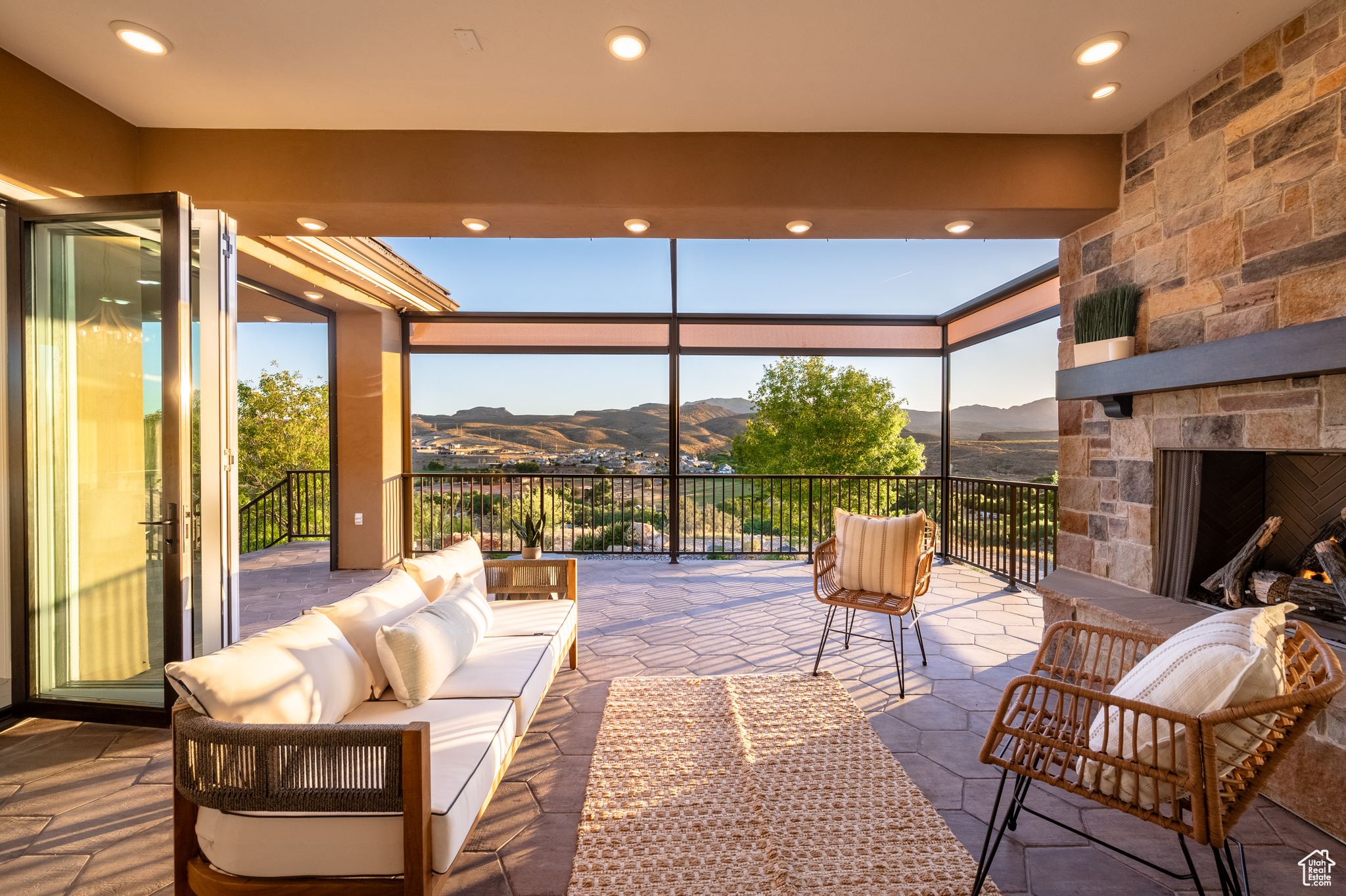 View of terrace featuring an outdoor living space with a fireplace and a mountain view