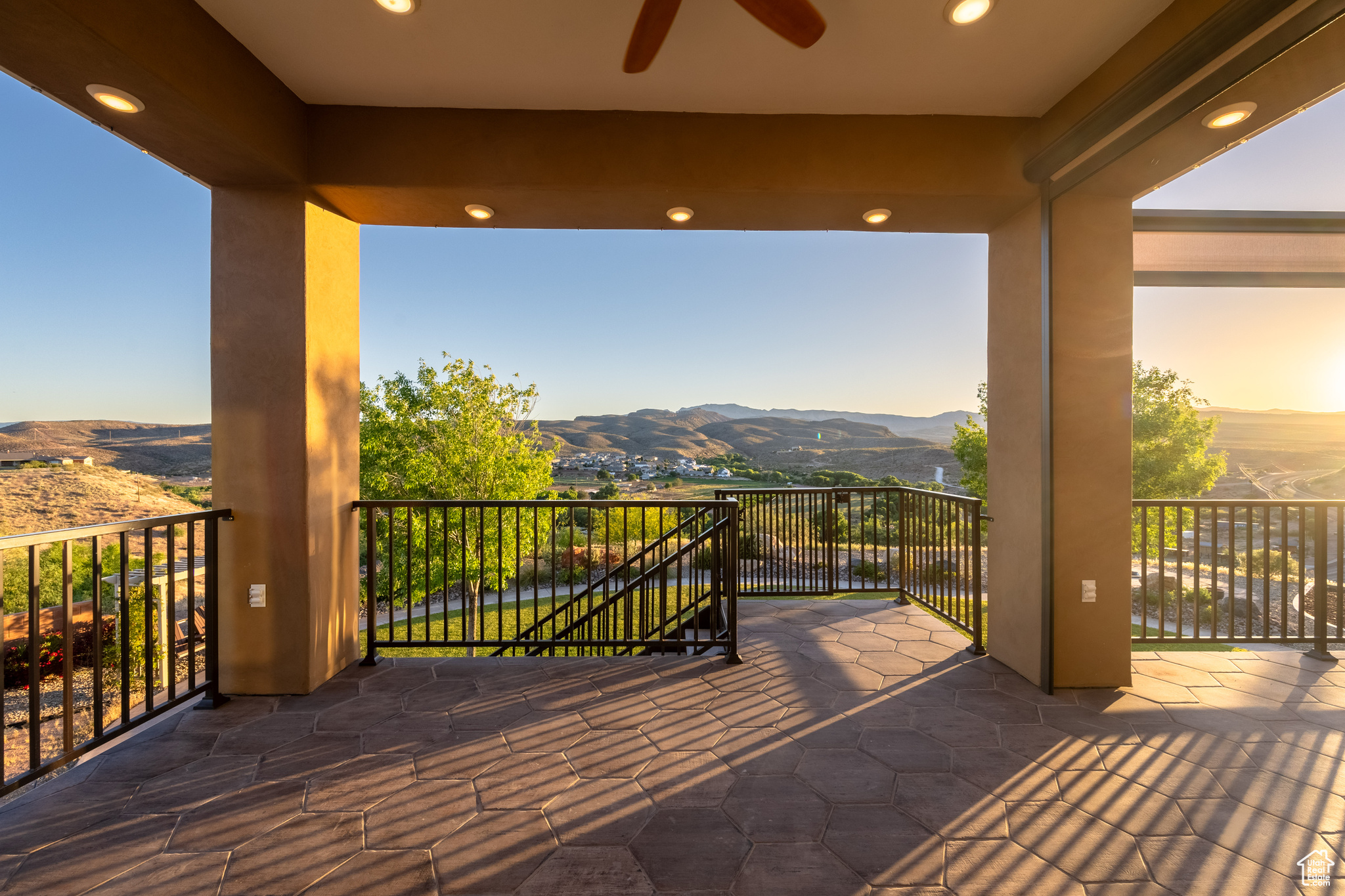 Wooden deck featuring ceiling fan and a mountain view