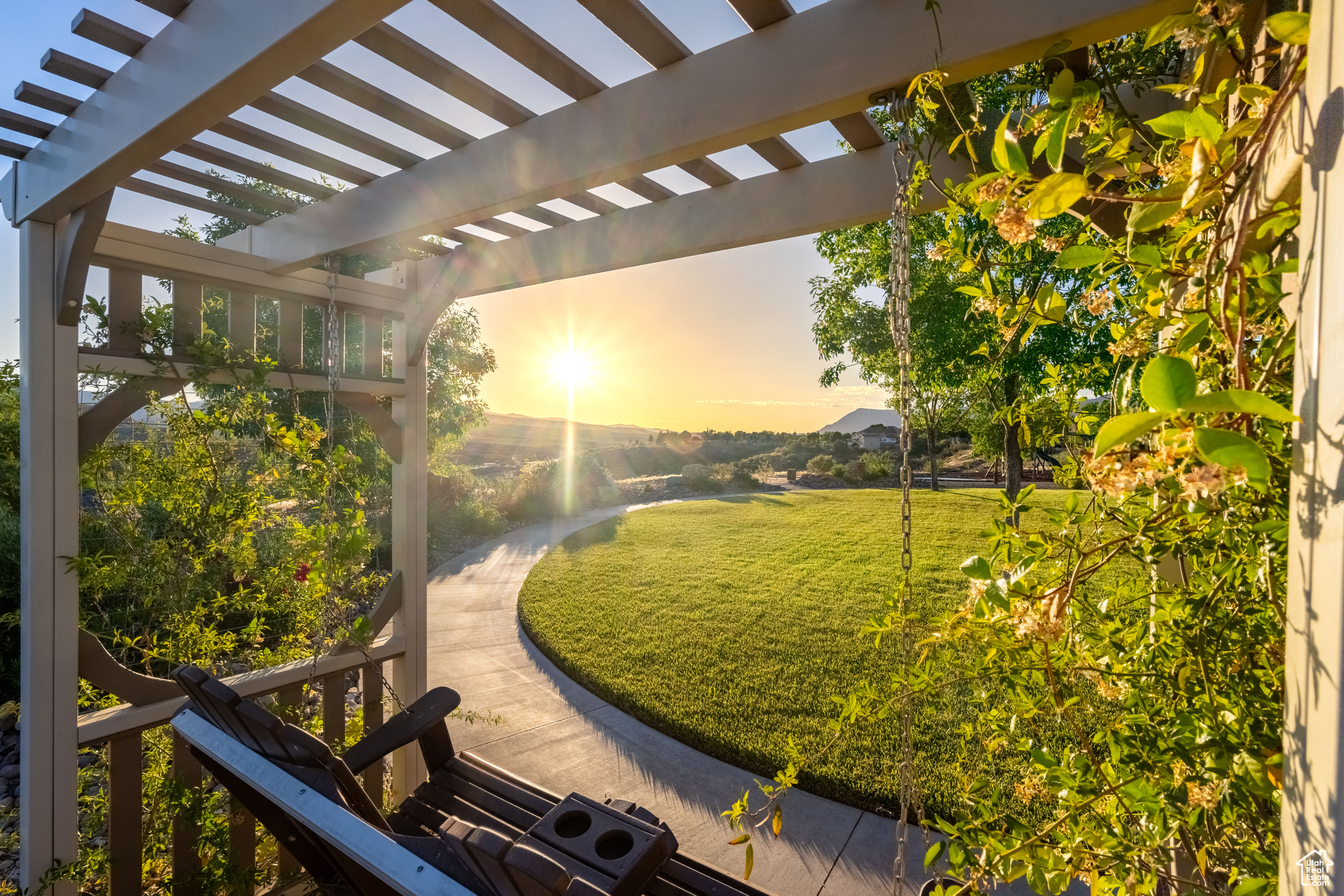 Yard at dusk featuring a pergola