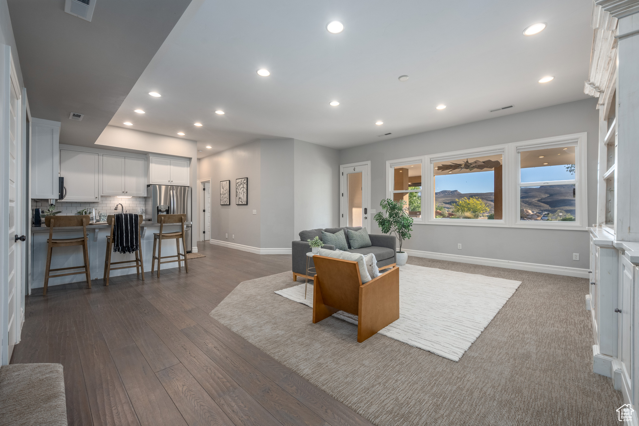 Living room with dark hardwood / wood-style floors