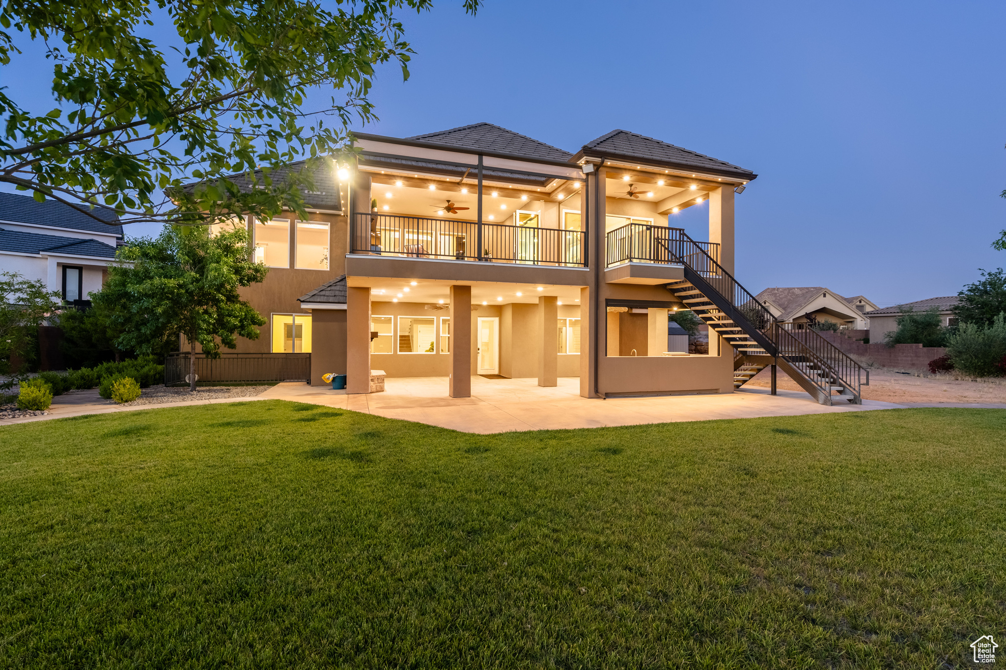 Rear view of property with a yard and a patio area