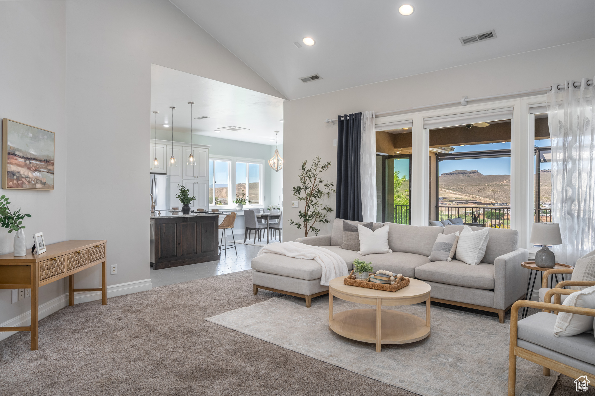 living room featuring high vaulted ceiling