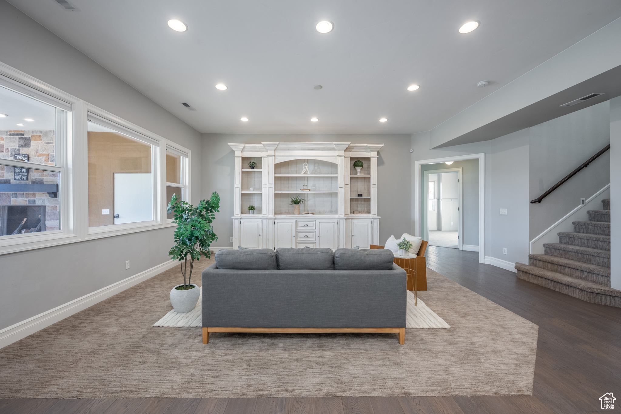 Living room featuring dark hardwood / wood-style flooring