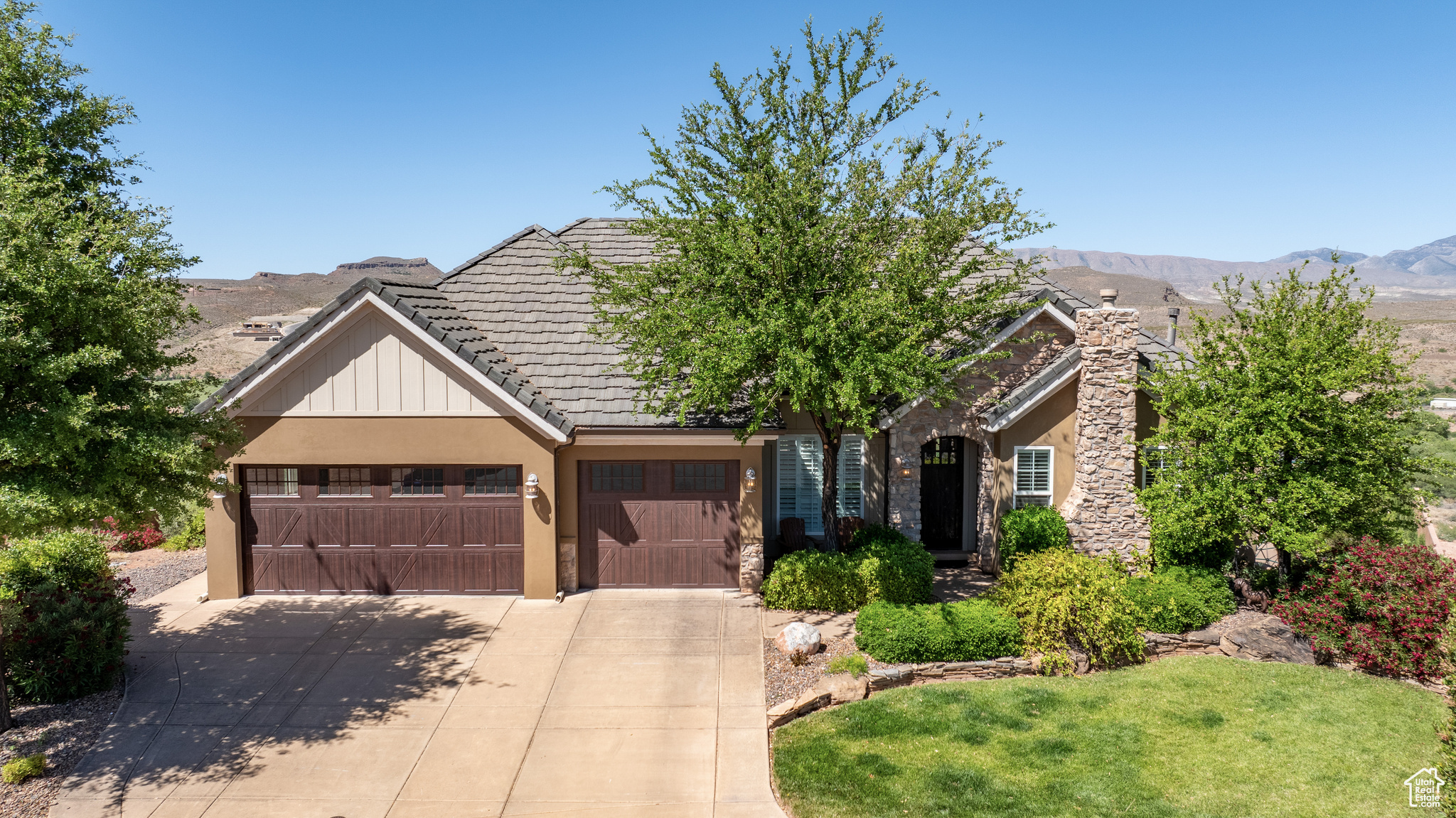 View of front of home featuring a garage and a mountain view