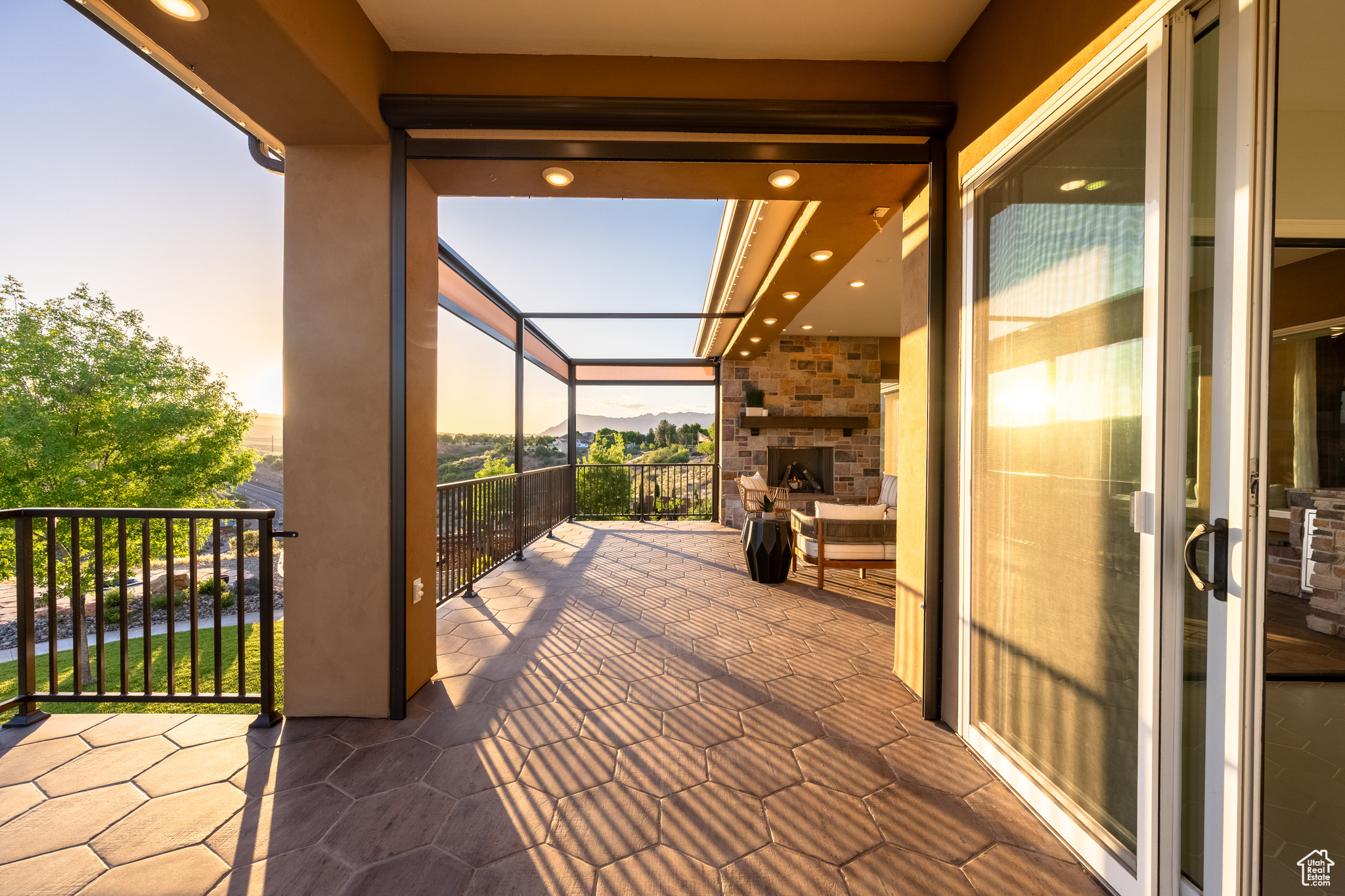 View of patio featuring a balcony