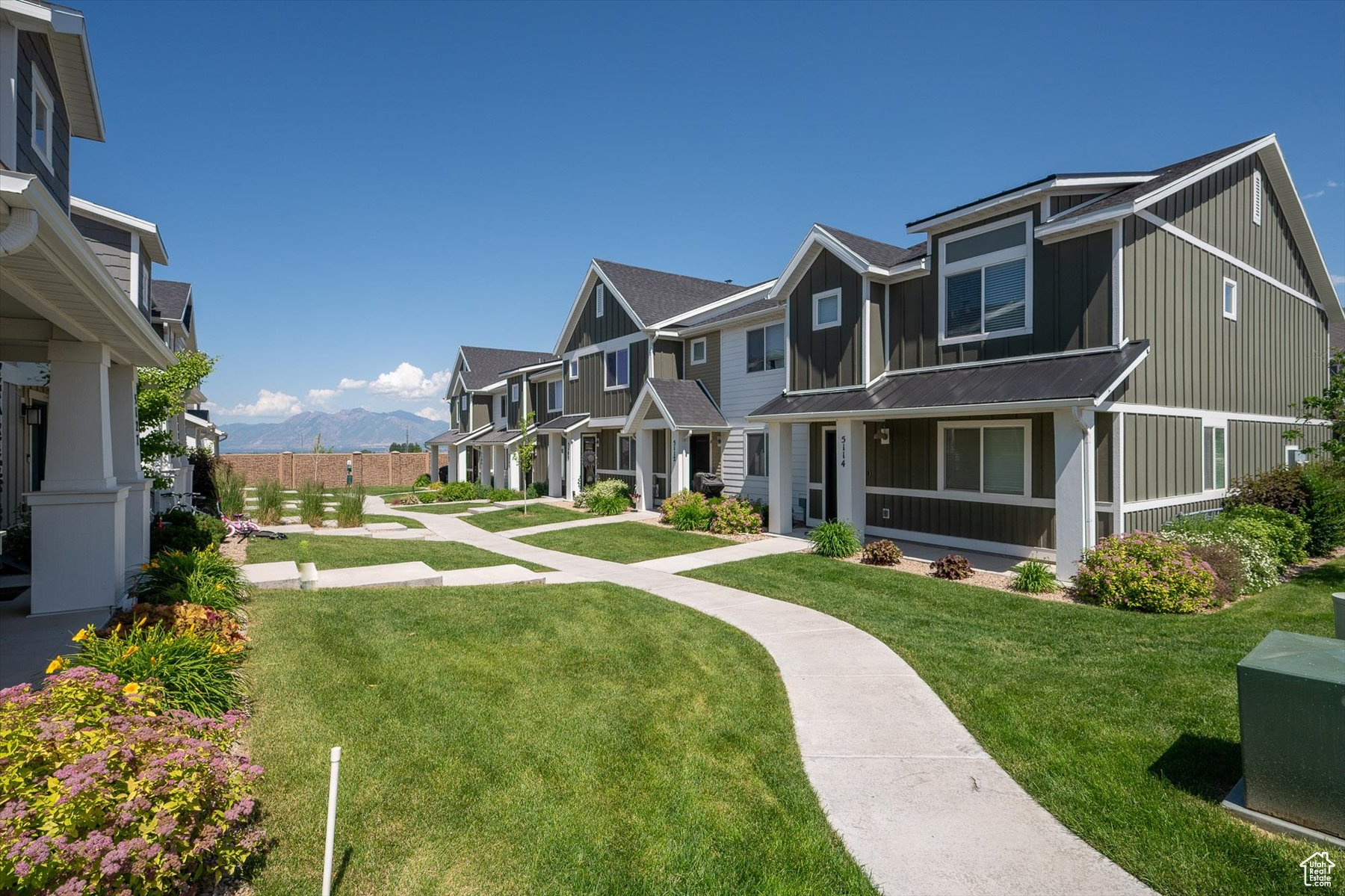 Exterior space featuring a front yard and a mountain view