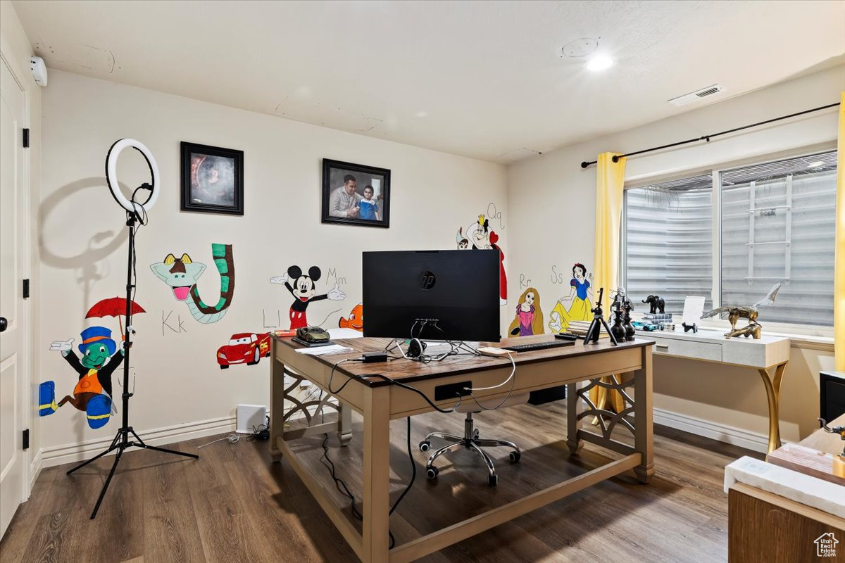 Home office featuring wood-type flooring