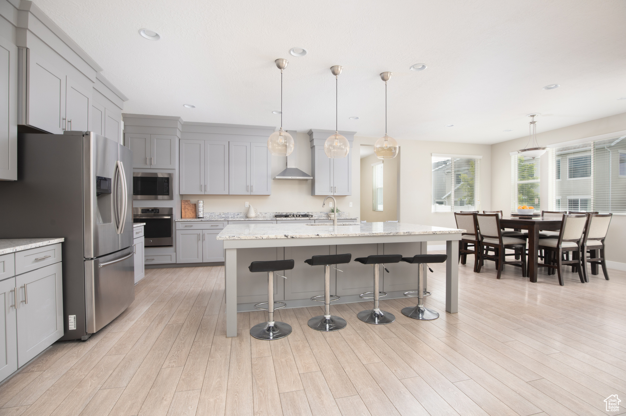 Kitchen with large island, appliances with stainless steel finishes