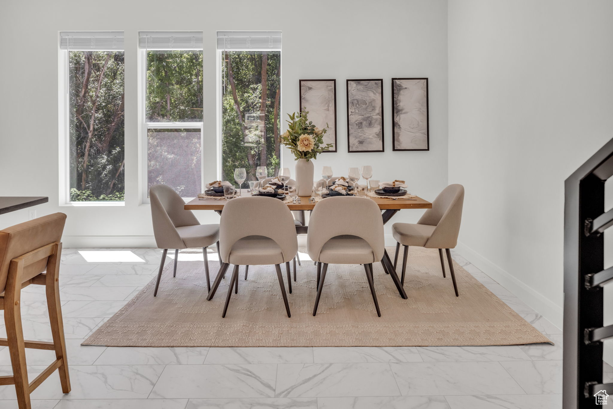 Dining area featuring plenty of natural light and light tile floors