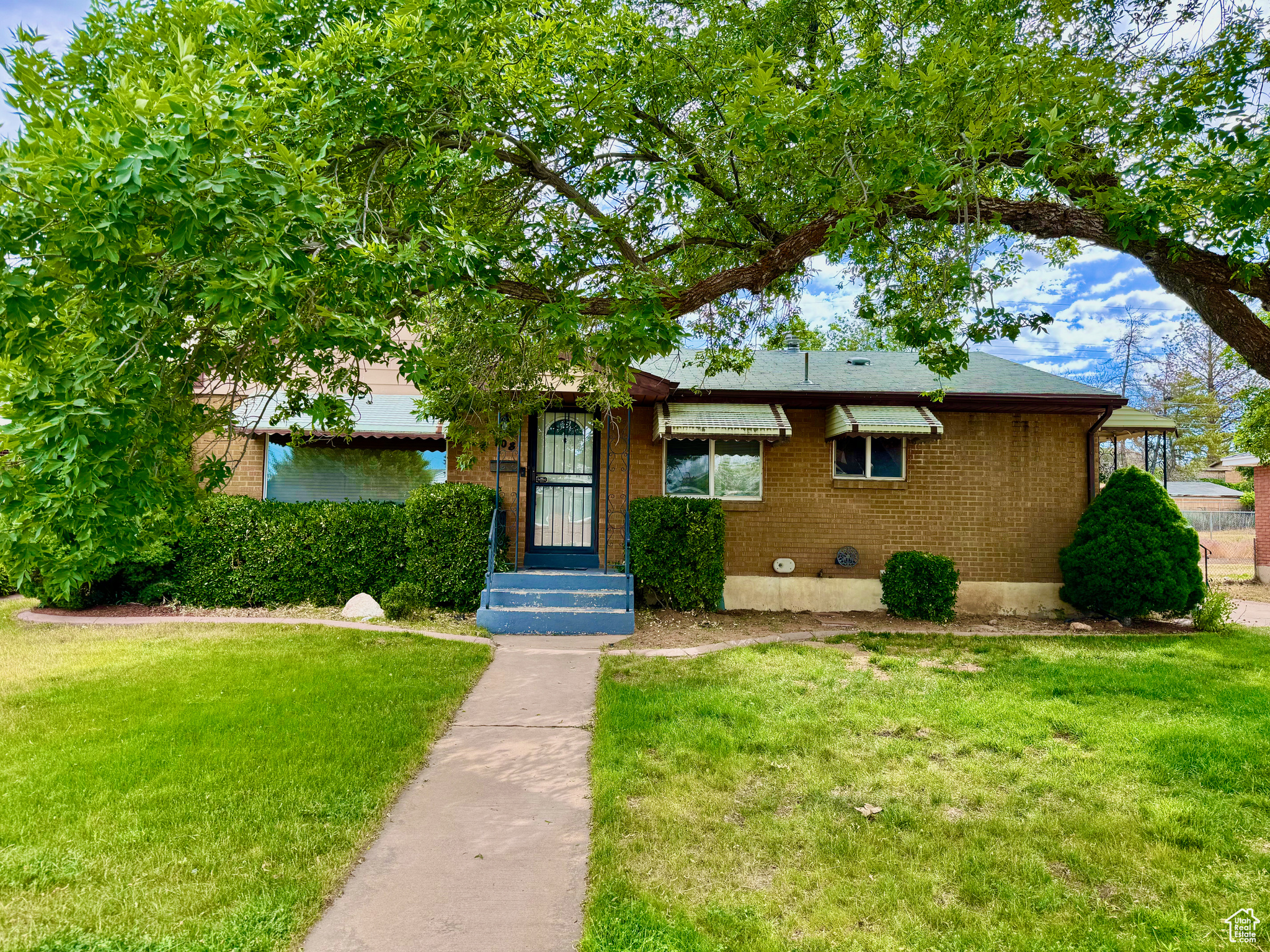 View of front of property with a front lawn