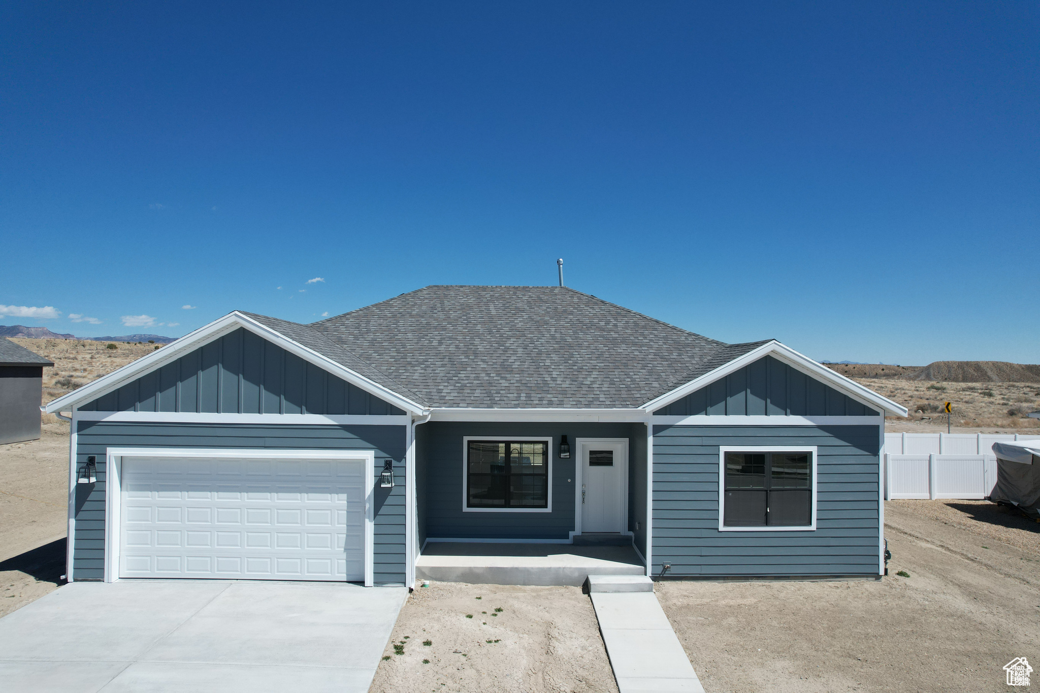 View of front of home featuring a garage