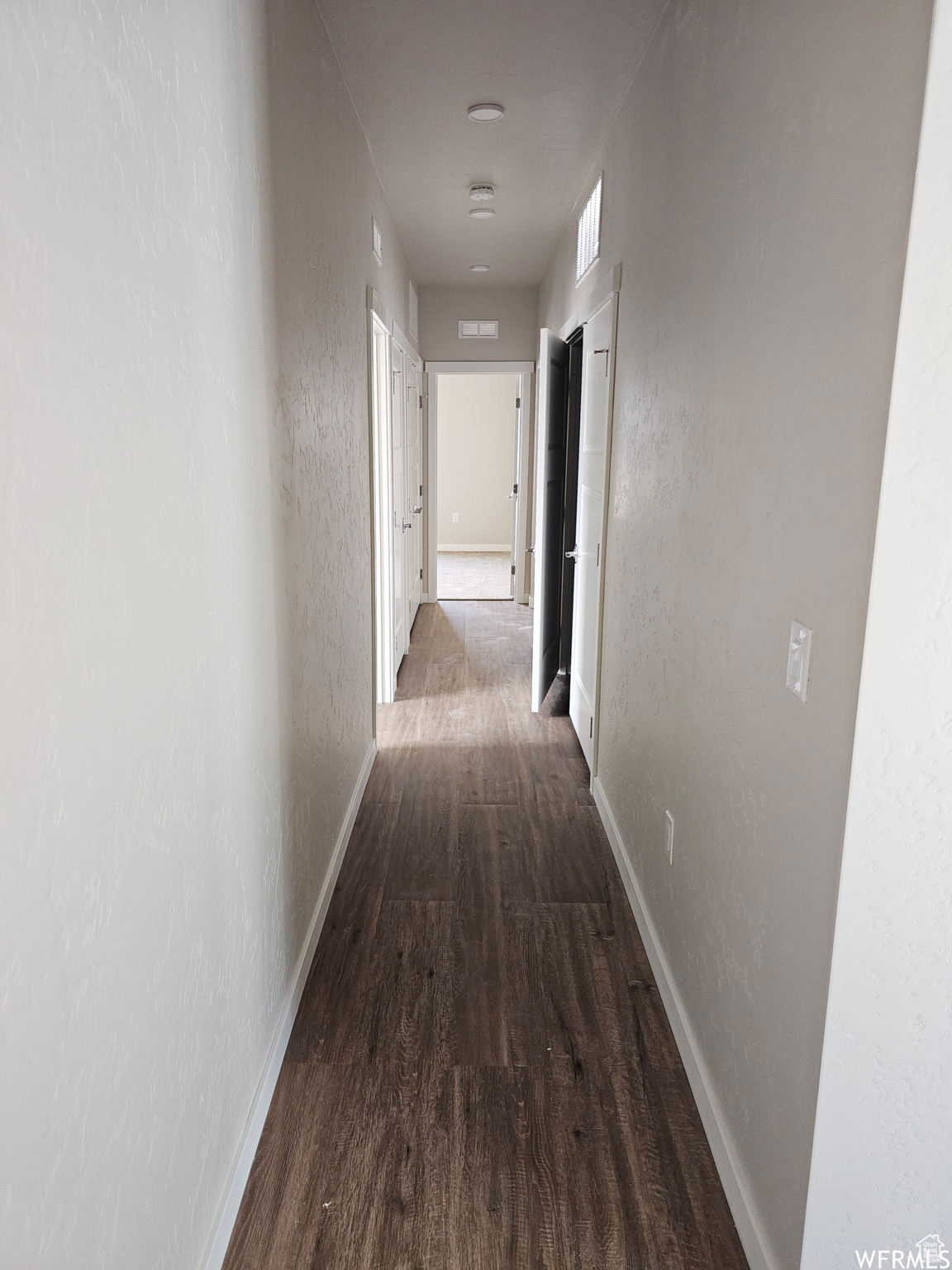 Hallway featuring hardwood / wood-style flooring