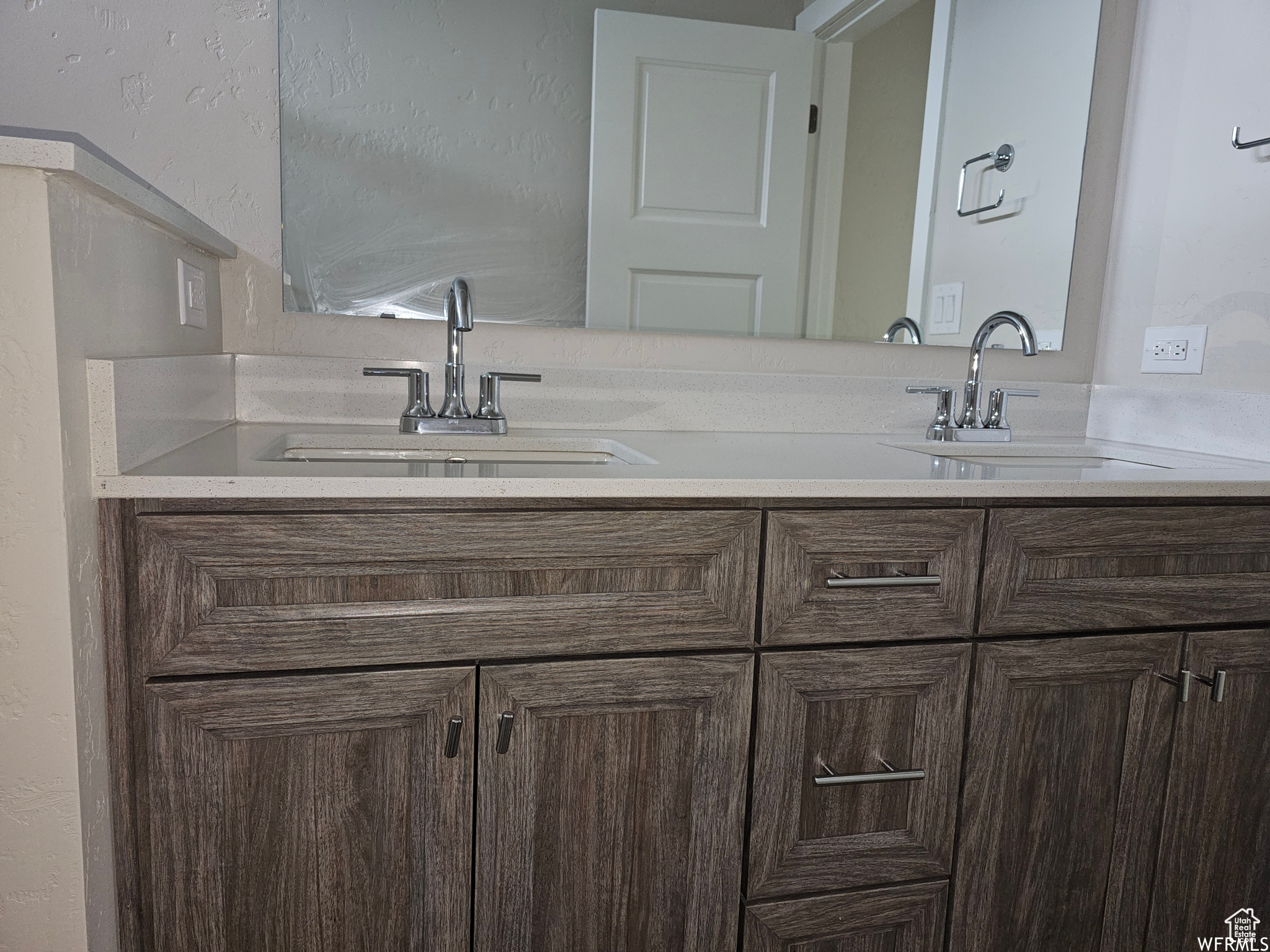 Bathroom featuring double vanity